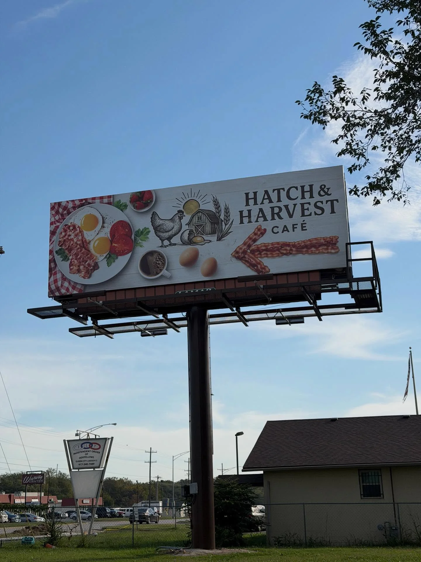 Hatch & Harvest Café billboard featuring breakfast items