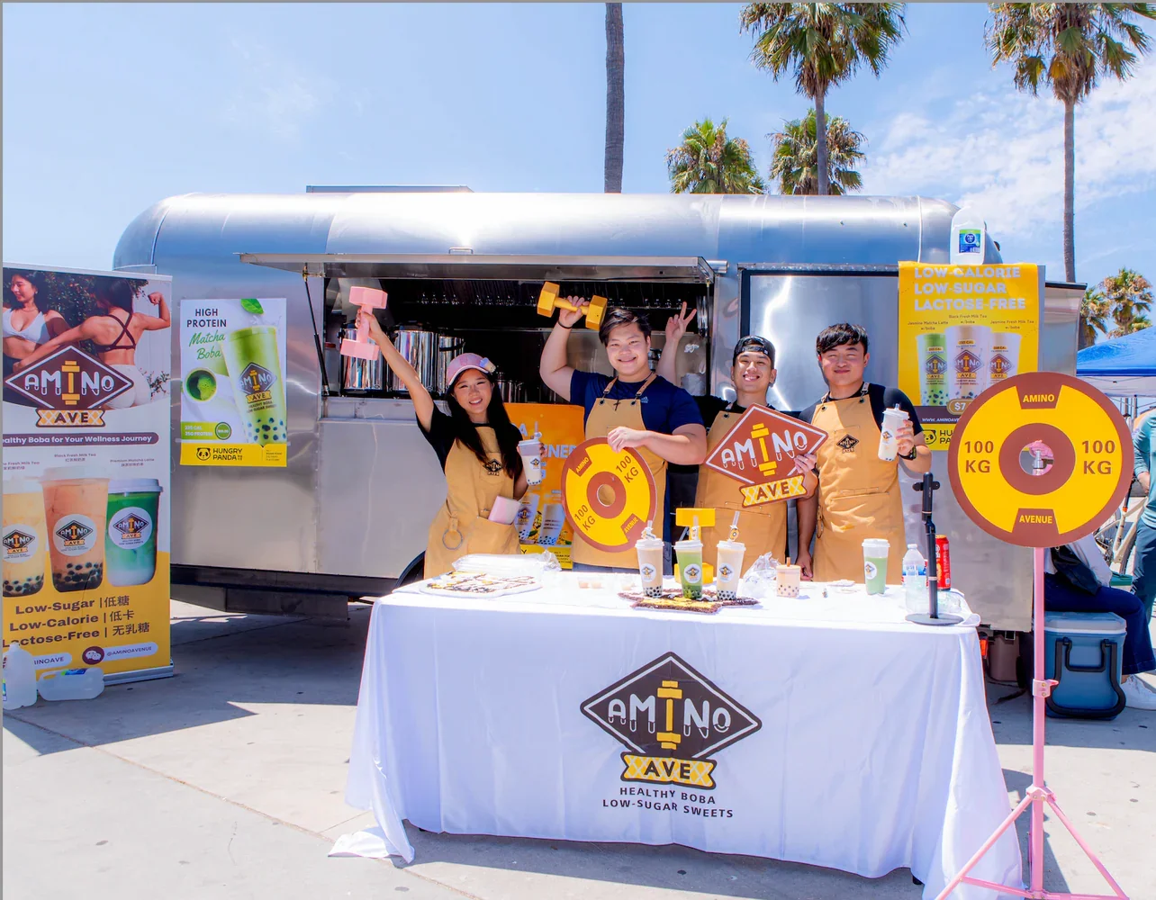 Amino boba tea stand promoting healthy drinks at a festival