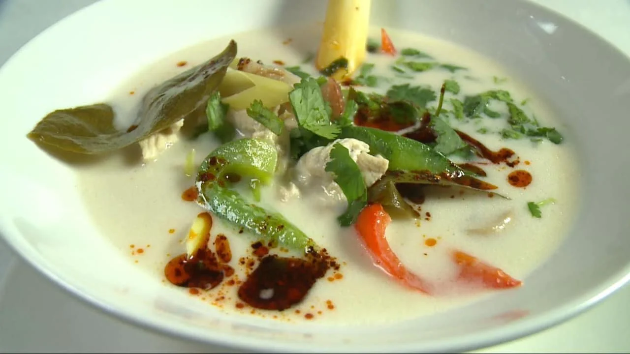 Thai coconut soup known as Tom Kha Gai with herbs and spices