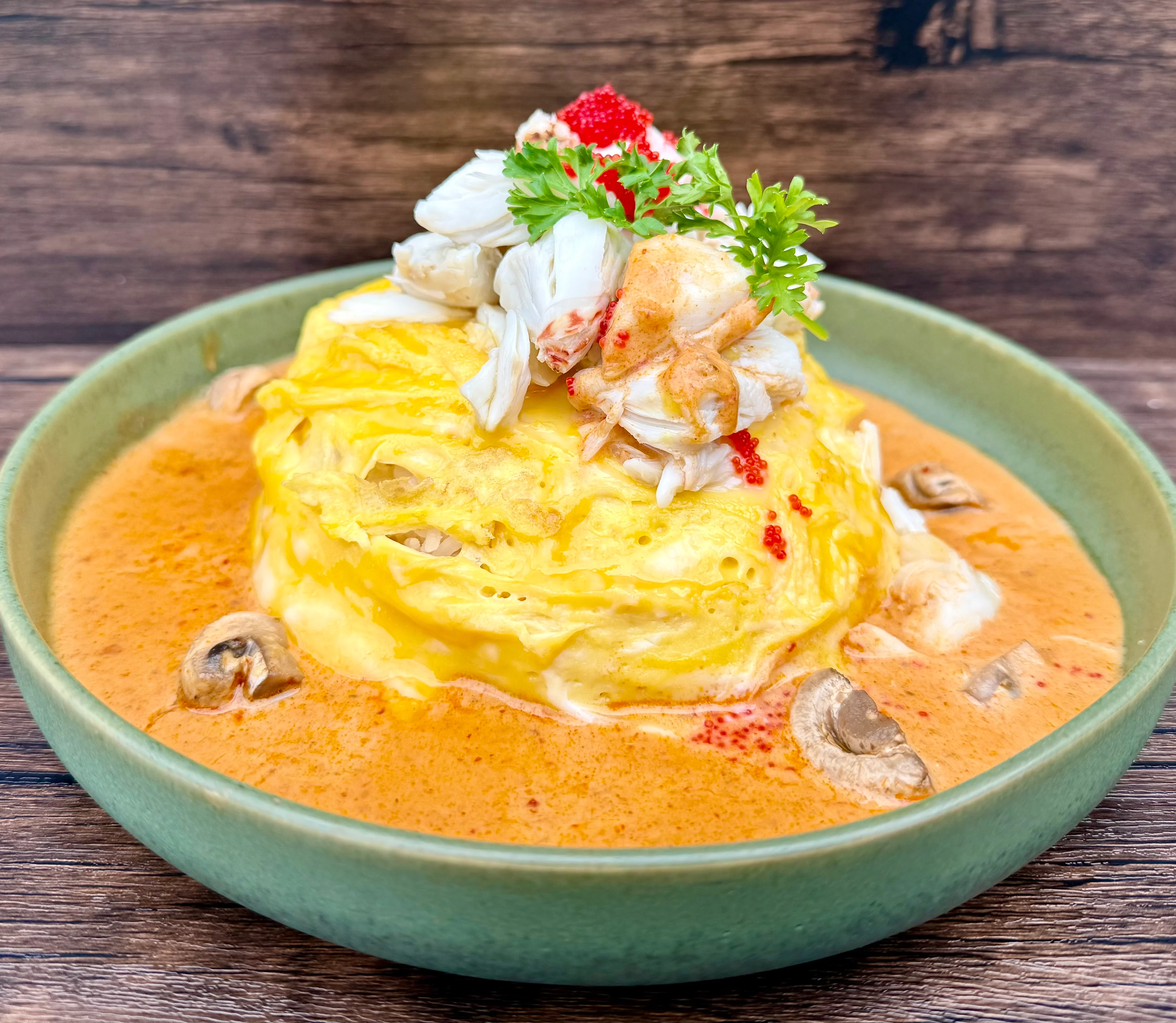 Singaporean chili crab omelette served in a rich sauce