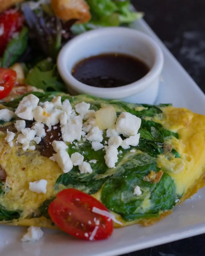 Spinach and feta omelette with salad and dipping sauce