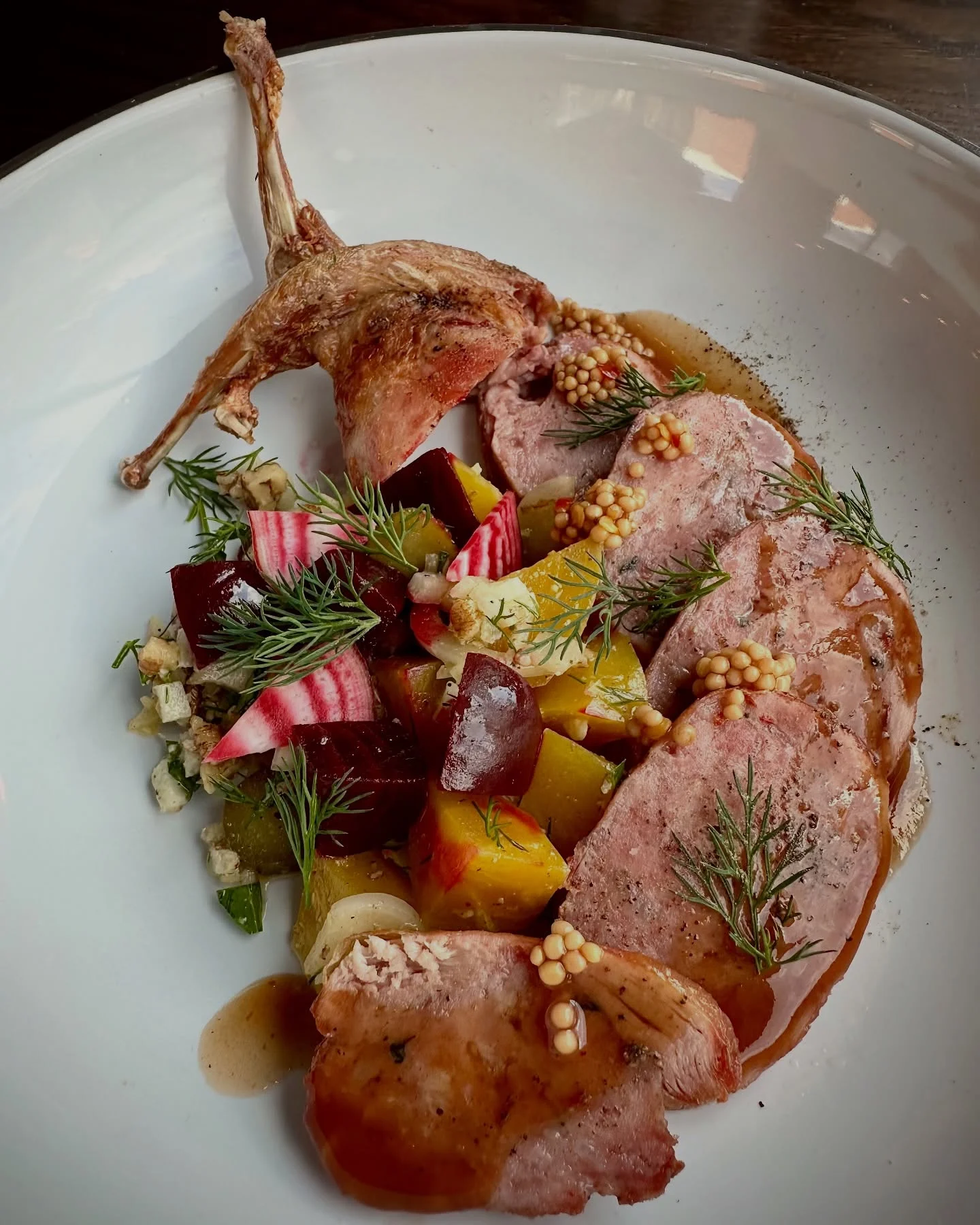 Duck confit with seasonal vegetables and mustard sauce