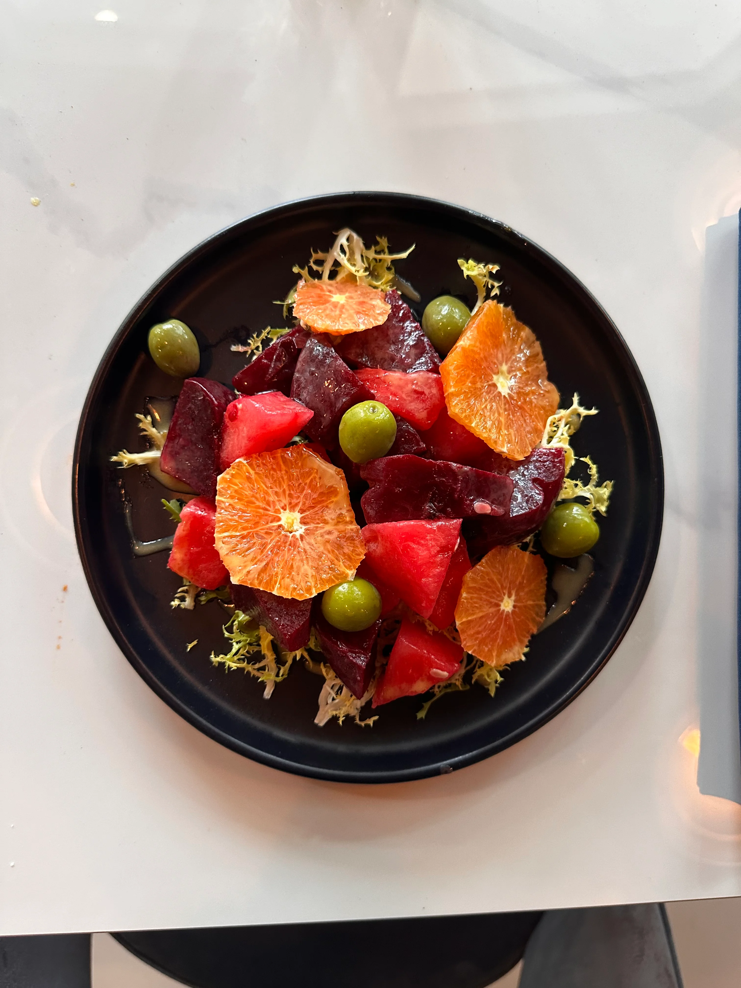 Colorful Mediterranean beet salad with citrus and olives