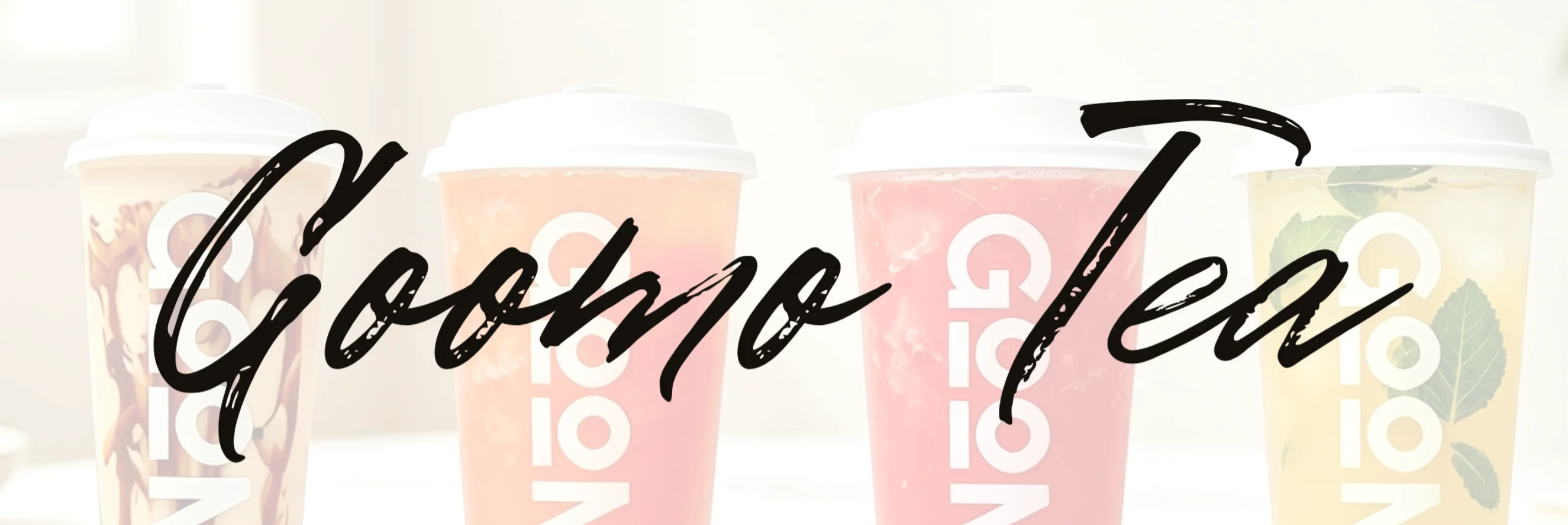 Colorful iced tea beverages in clear cups with lids