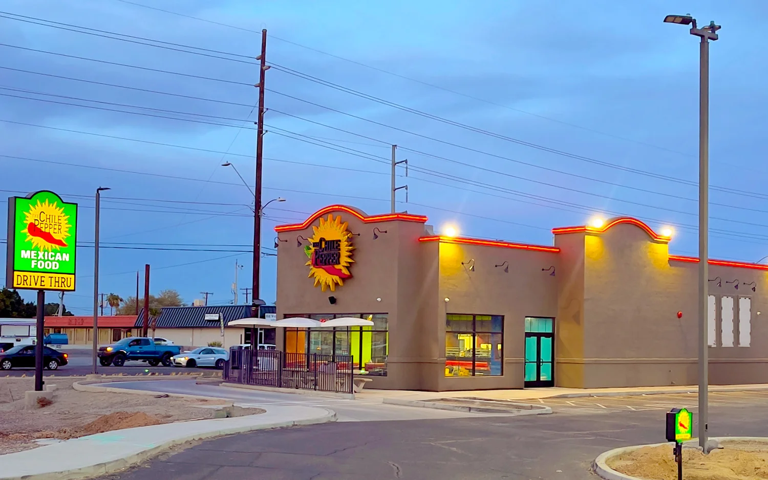 Exterior view of a vibrant Mexican restaurant with drive-thru