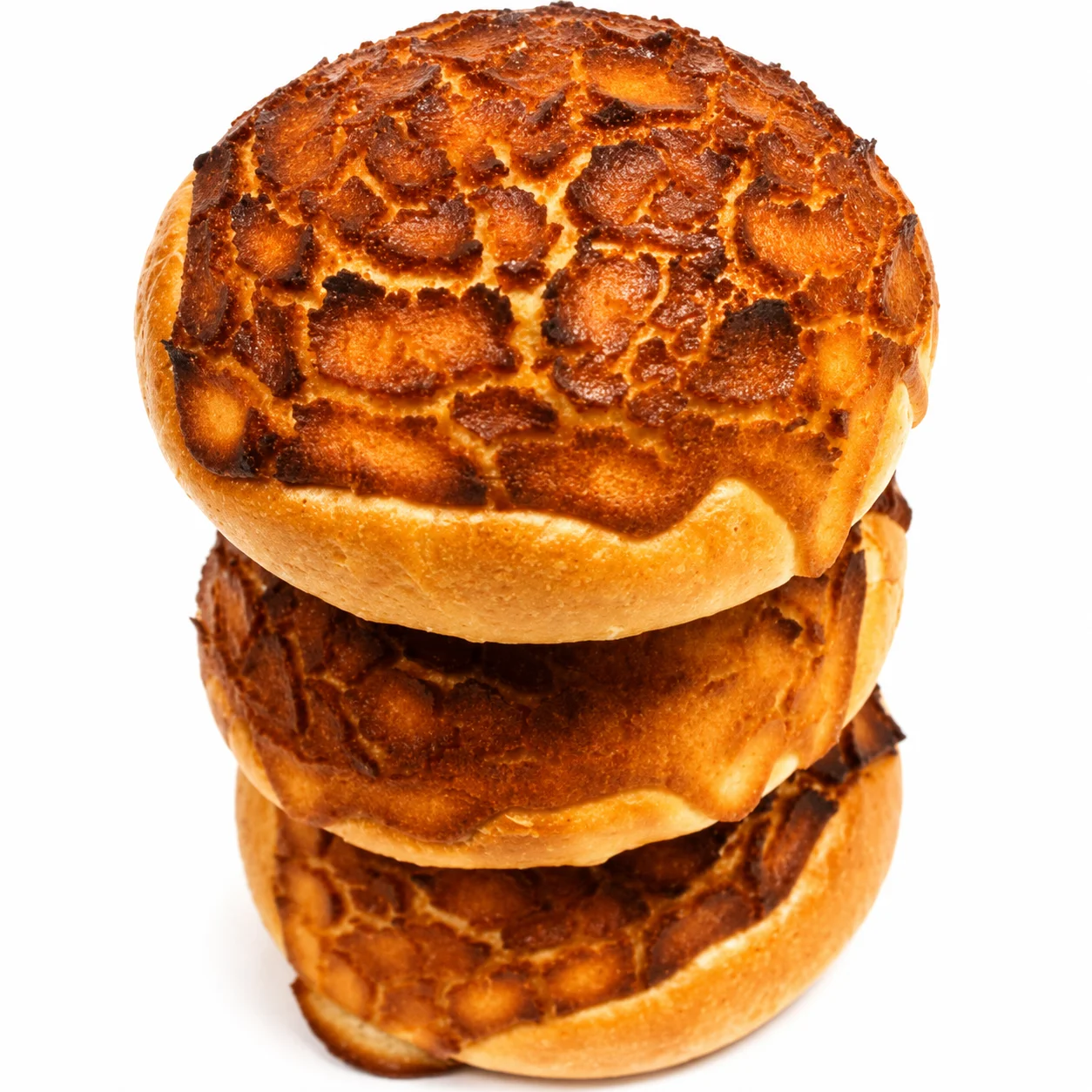 Three stacked golden-brown bread rolls with a textured surface.