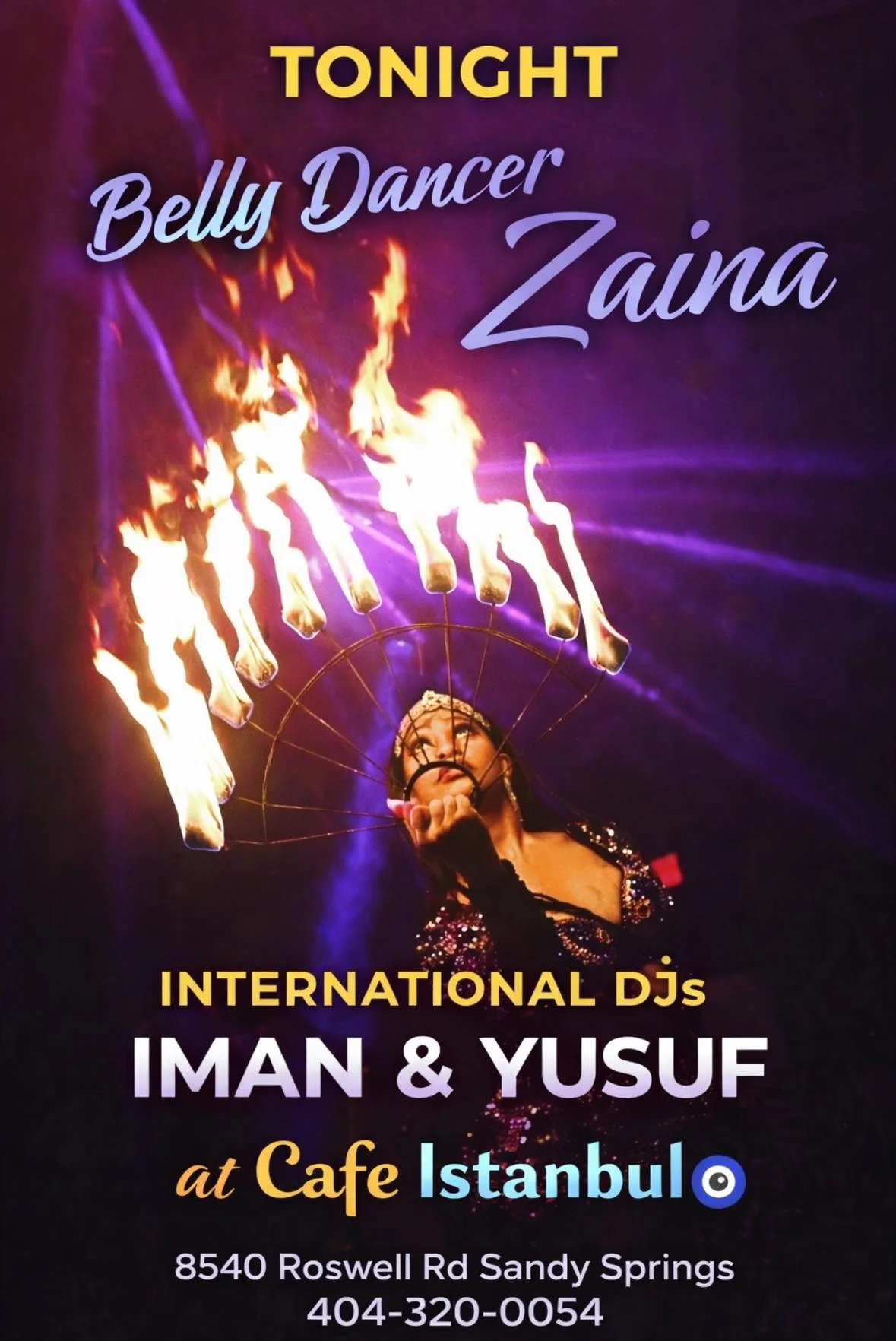 A lively performance featuring a belly dancer amidst colorful lights and flames.