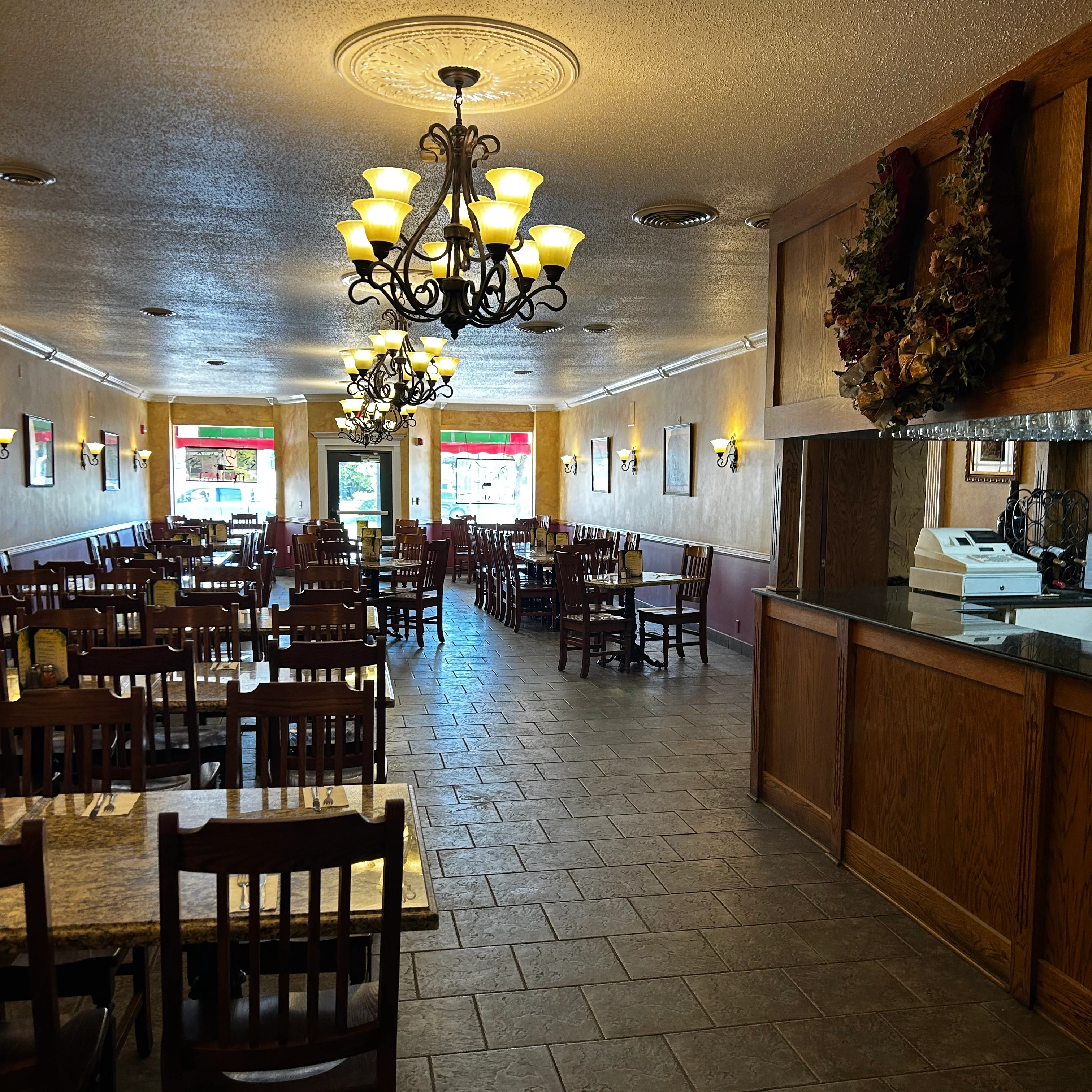 Cozy restaurant interior with wooden tables and warm lighting