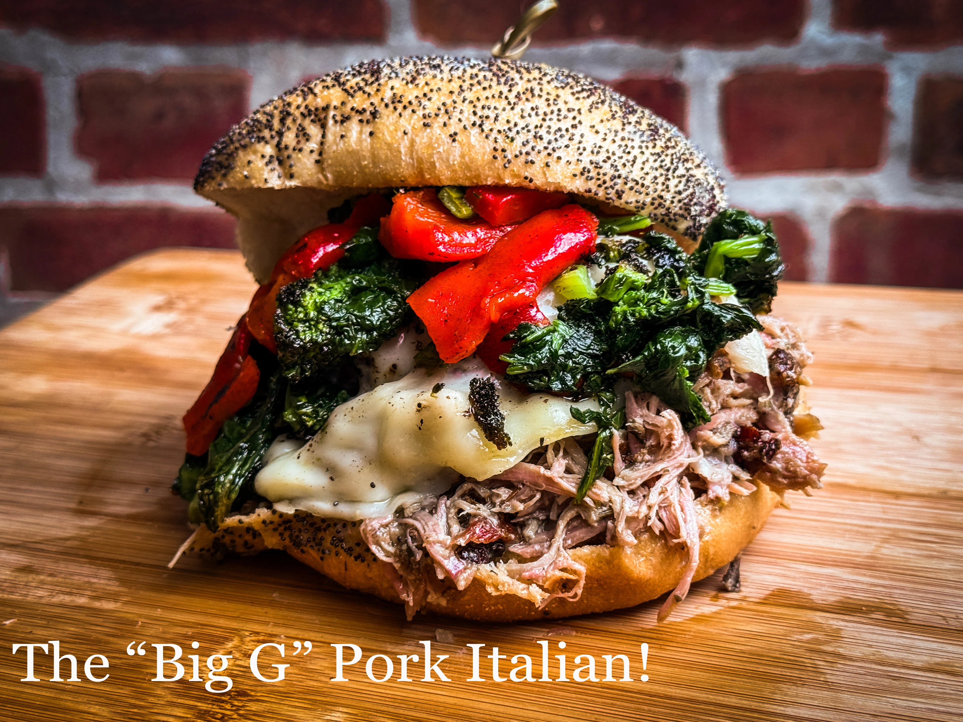 A hearty sandwich filled with shredded pork, roasted red peppers, sautéed greens, and cheese, served in a poppy seed bun.
