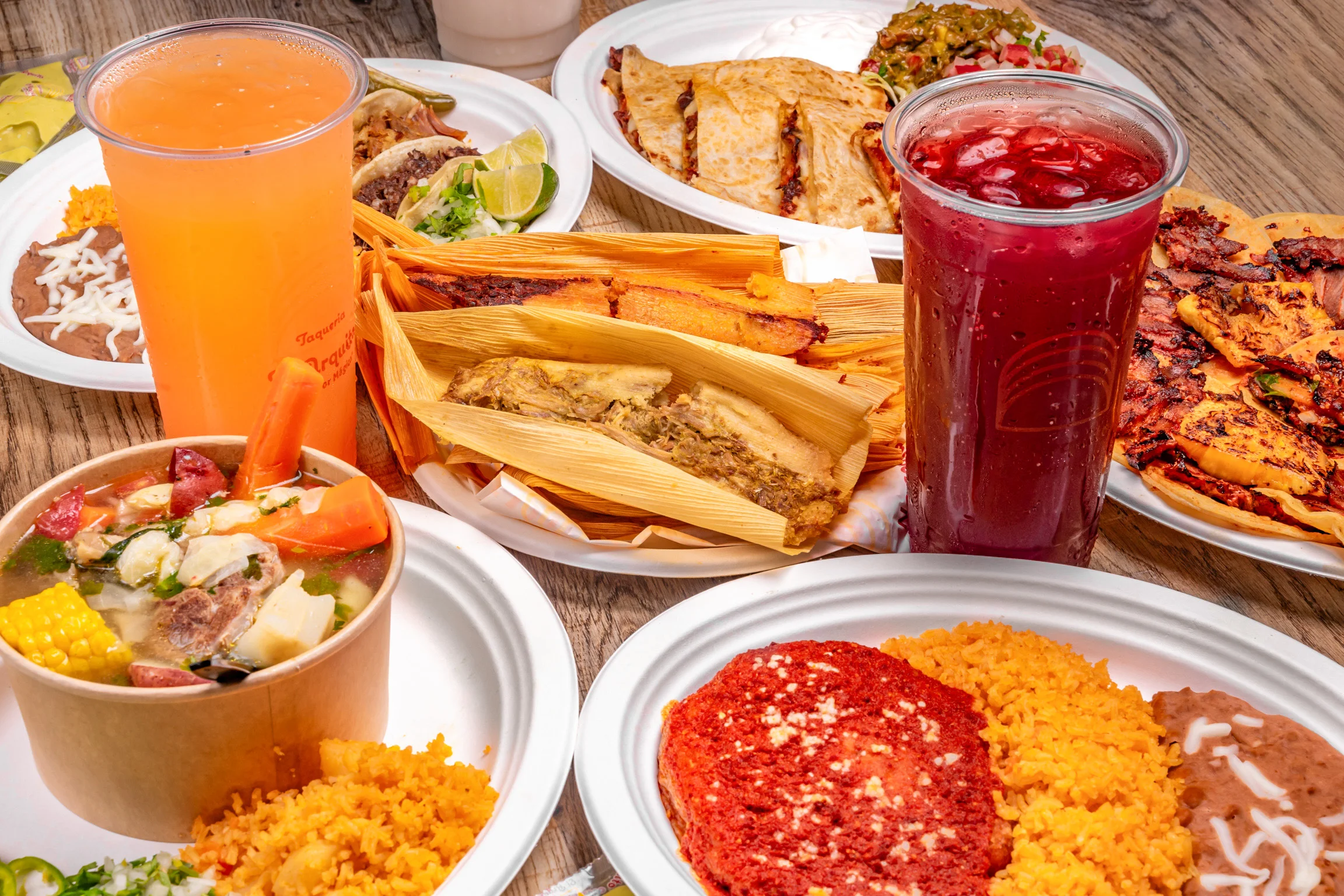 Colorful Mexican feast with tamales, tacos, and rice