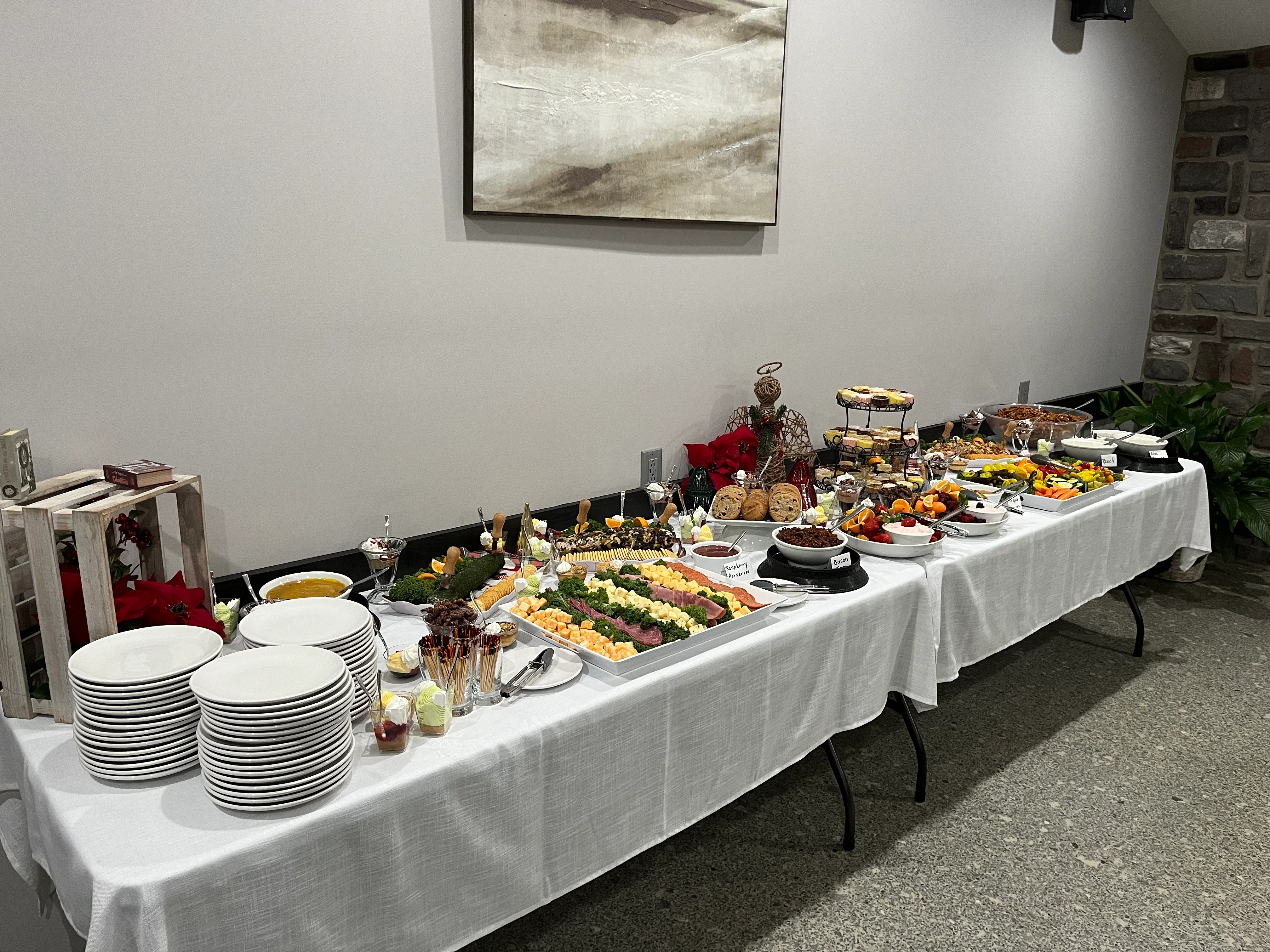 Buffet spread featuring assorted appetizers and desserts