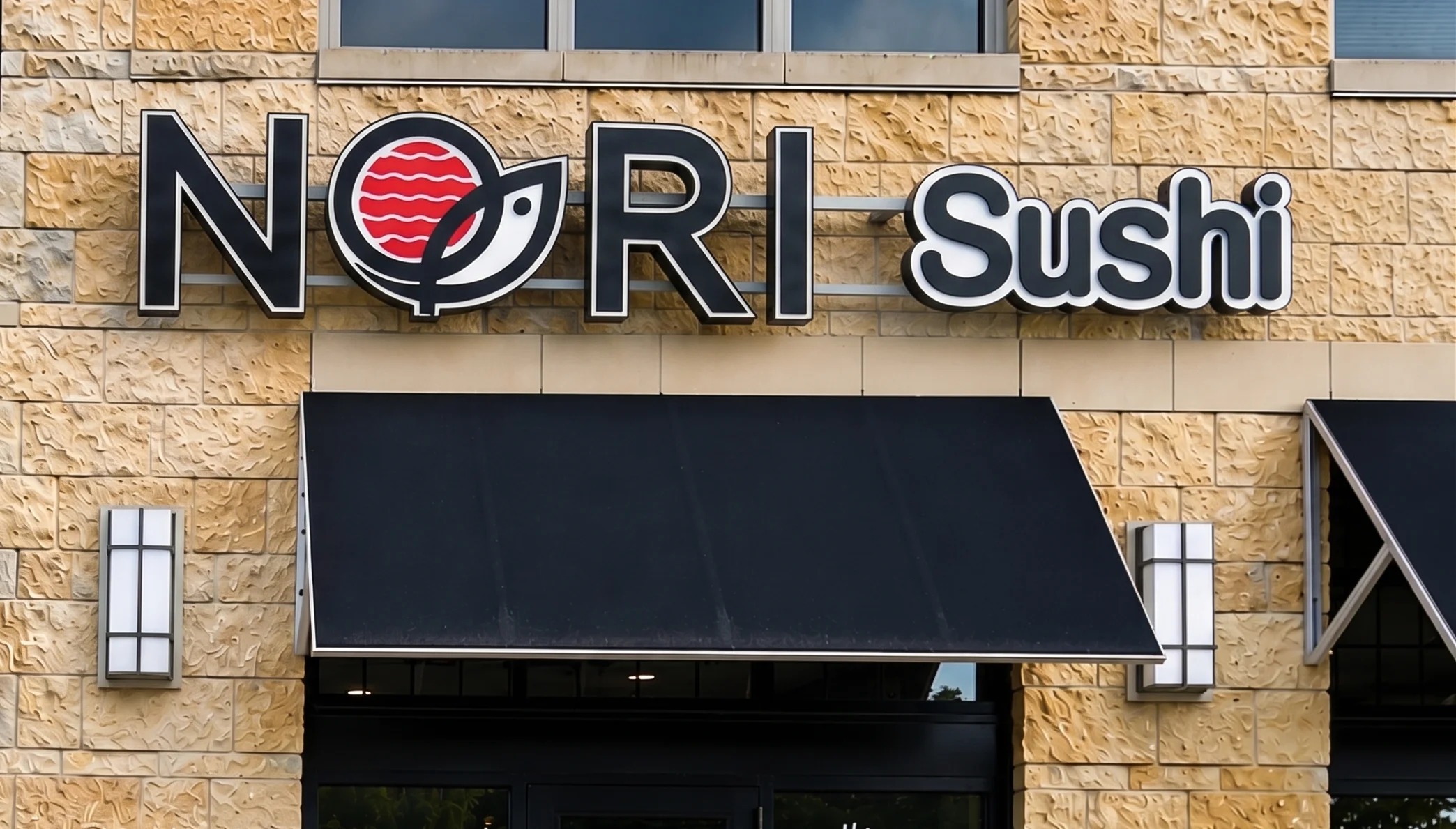 Exterior view of Nori Sushi restaurant with modern signage
