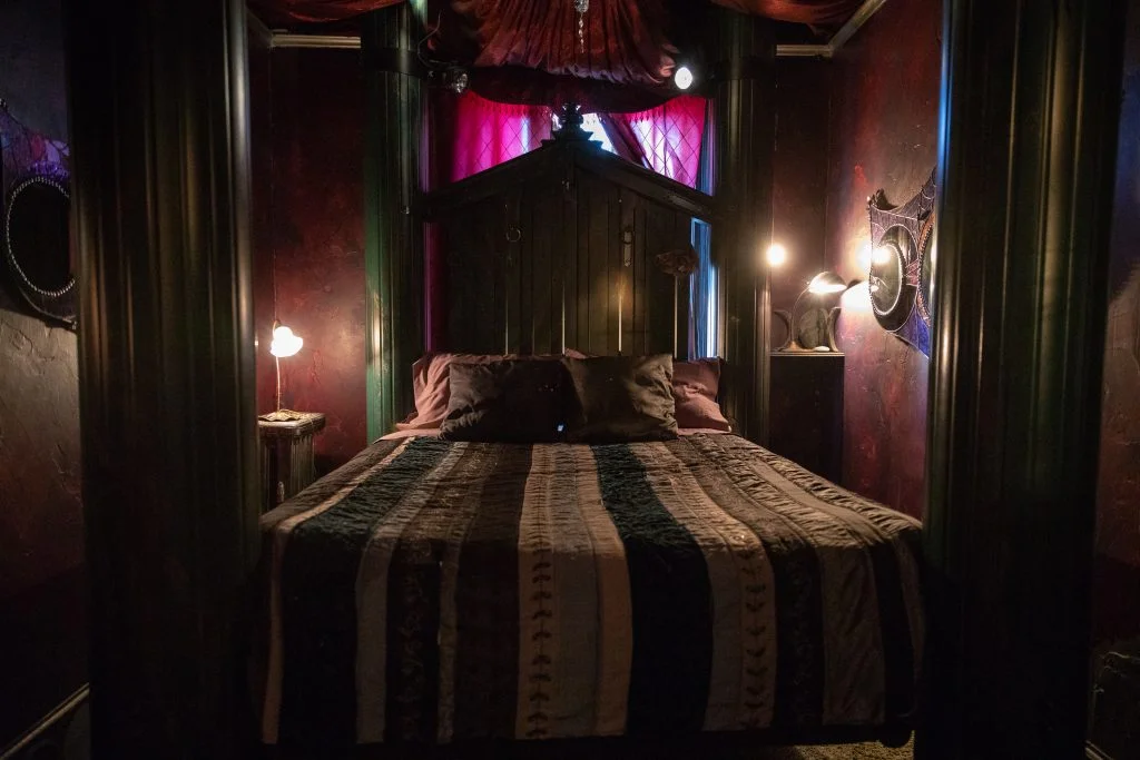 Cozy bedroom with dark decor and warm lighting
