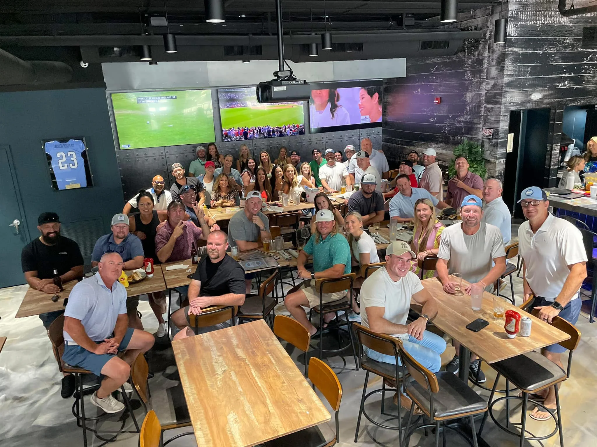 Group of friends enjoying a lively gathering in a restaurant