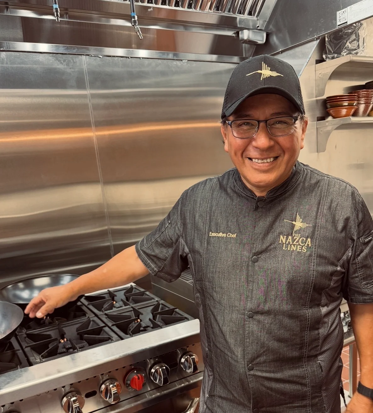 Executive chef in a modern kitchen preparing for service