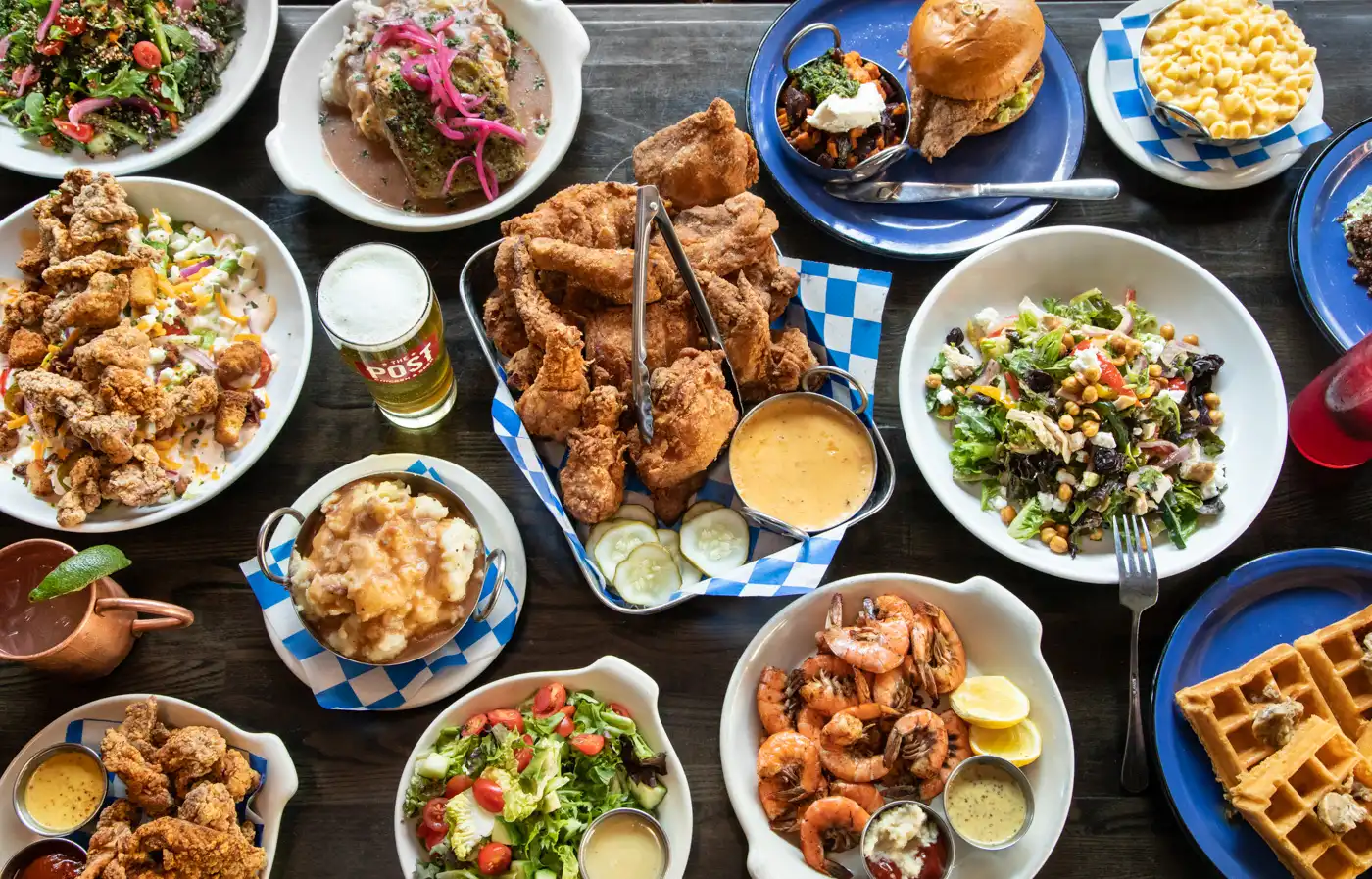 plates of fried chicken and food on table 