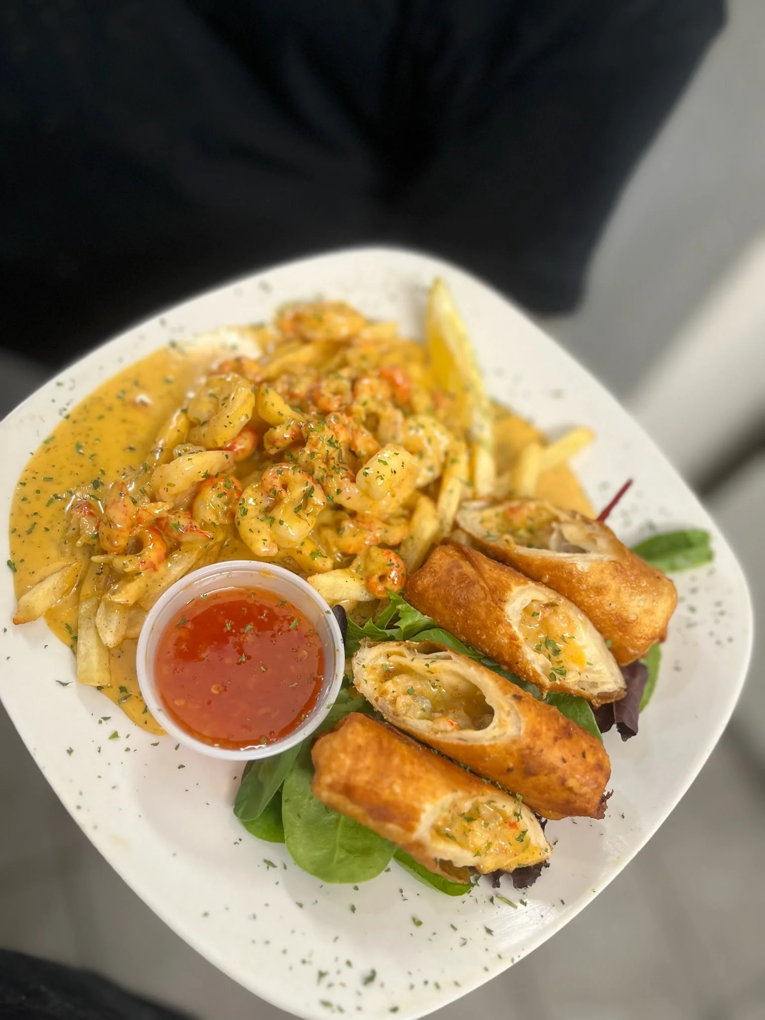 Cajun shrimp fries with spring rolls and dipping sauce