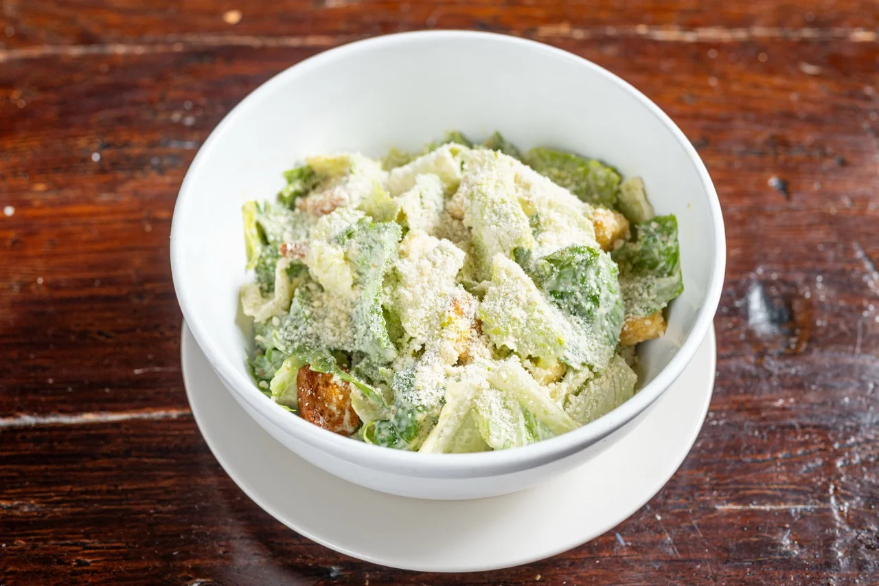 Classic Caesar salad topped with Parmesan cheese