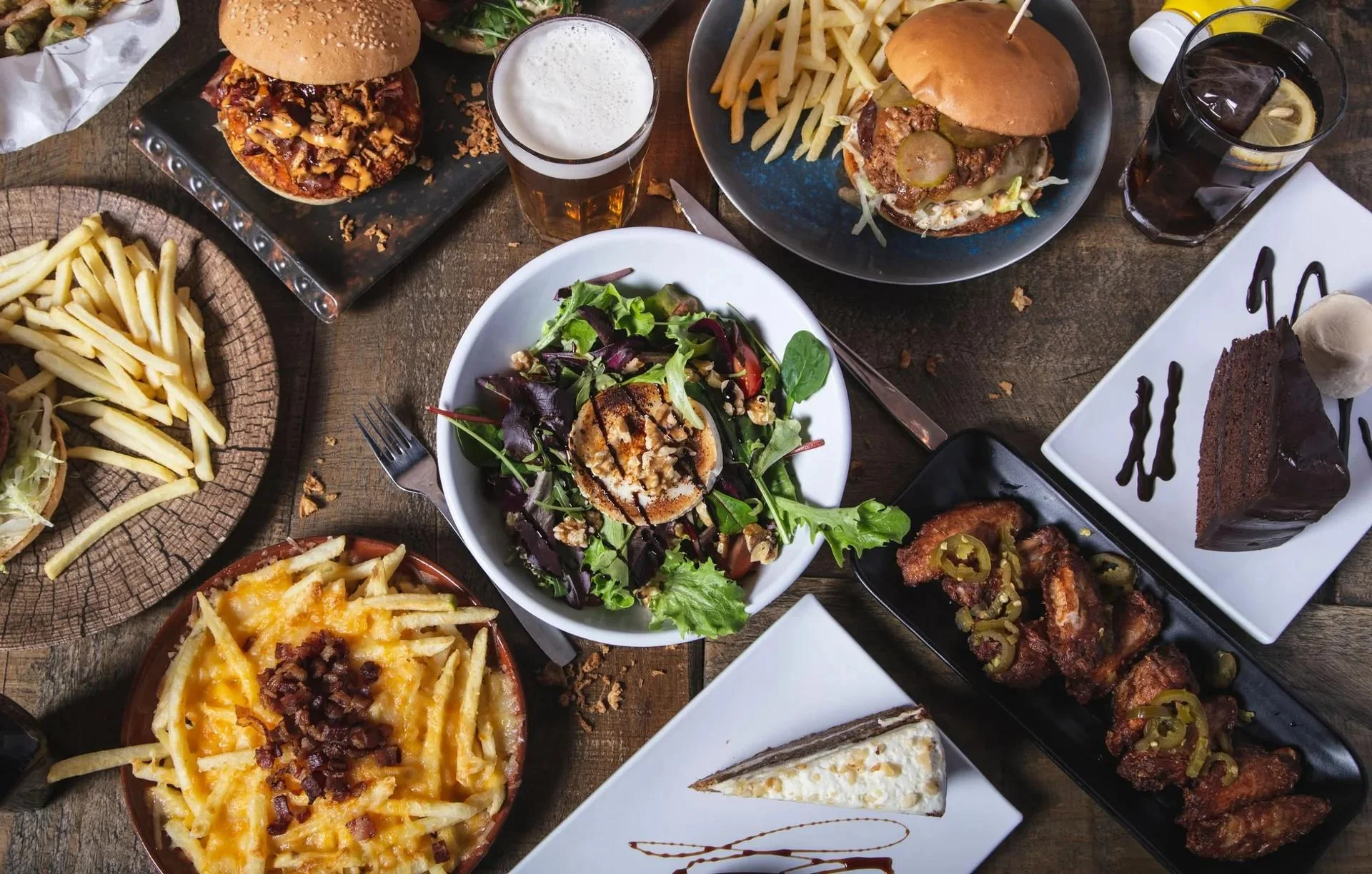 Delicious gourmet burger with fresh toppings on a wooden table