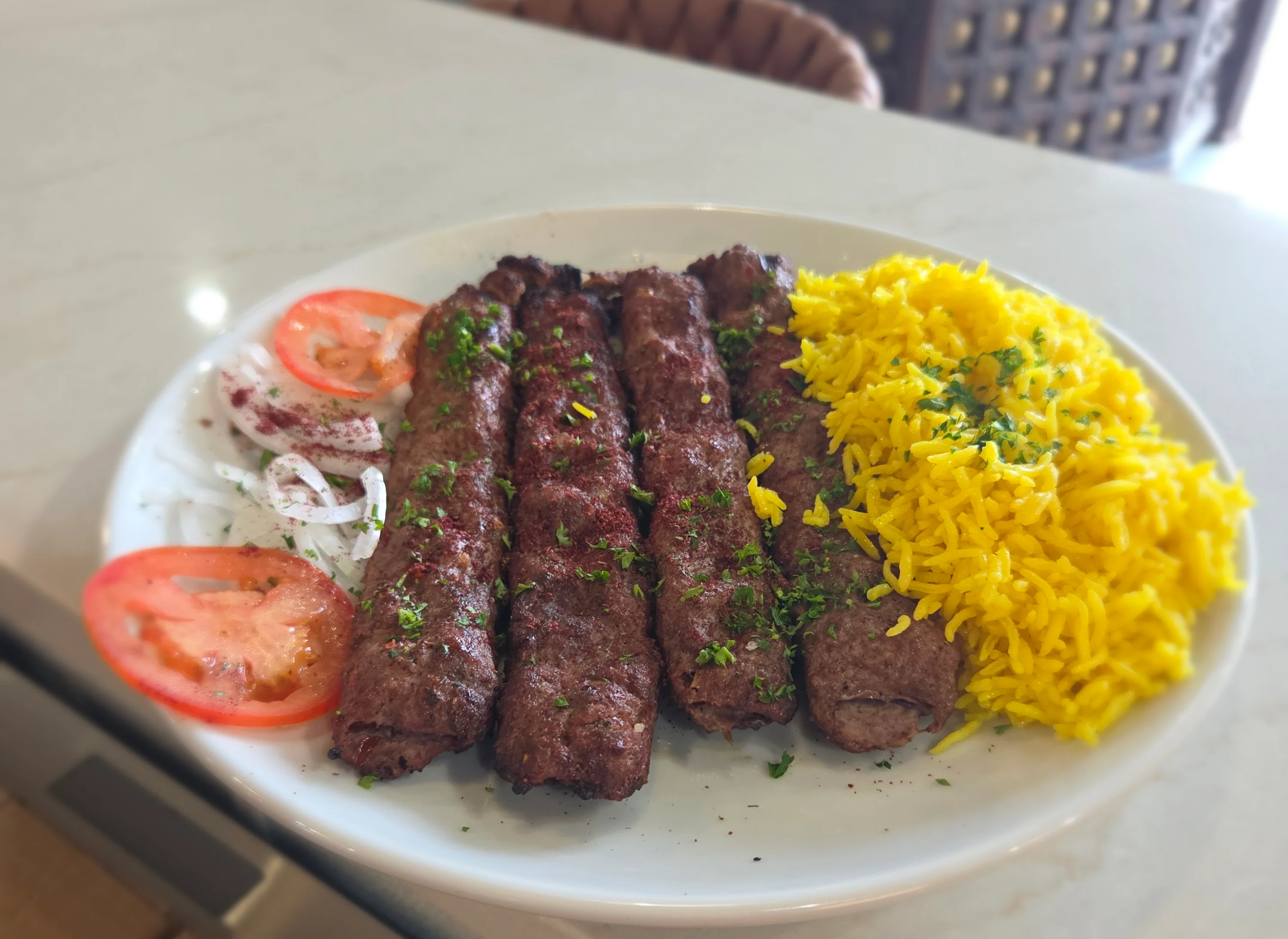 Grilled kebabs served with saffron rice