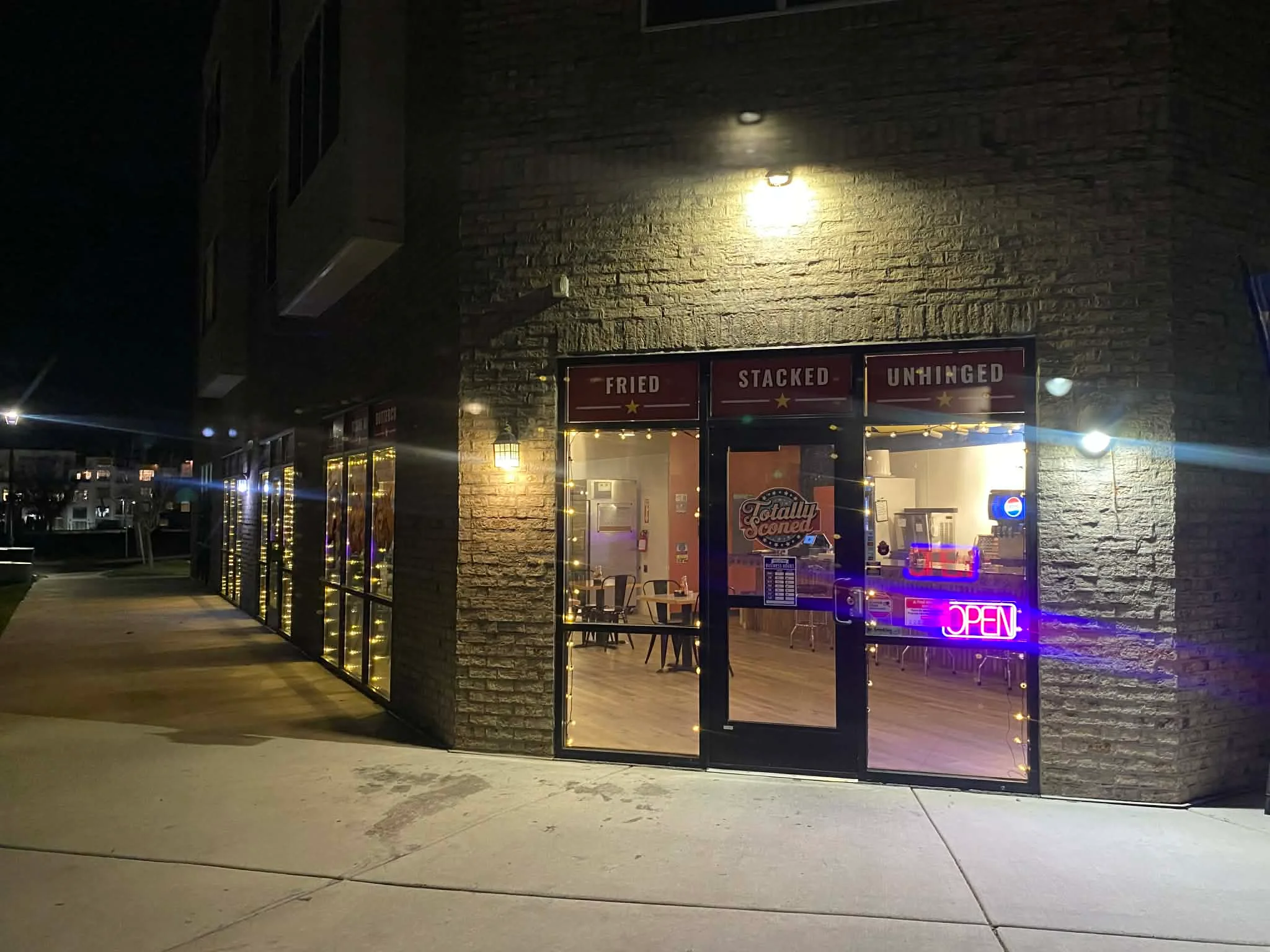 Cozy restaurant entrance with warm lighting at night