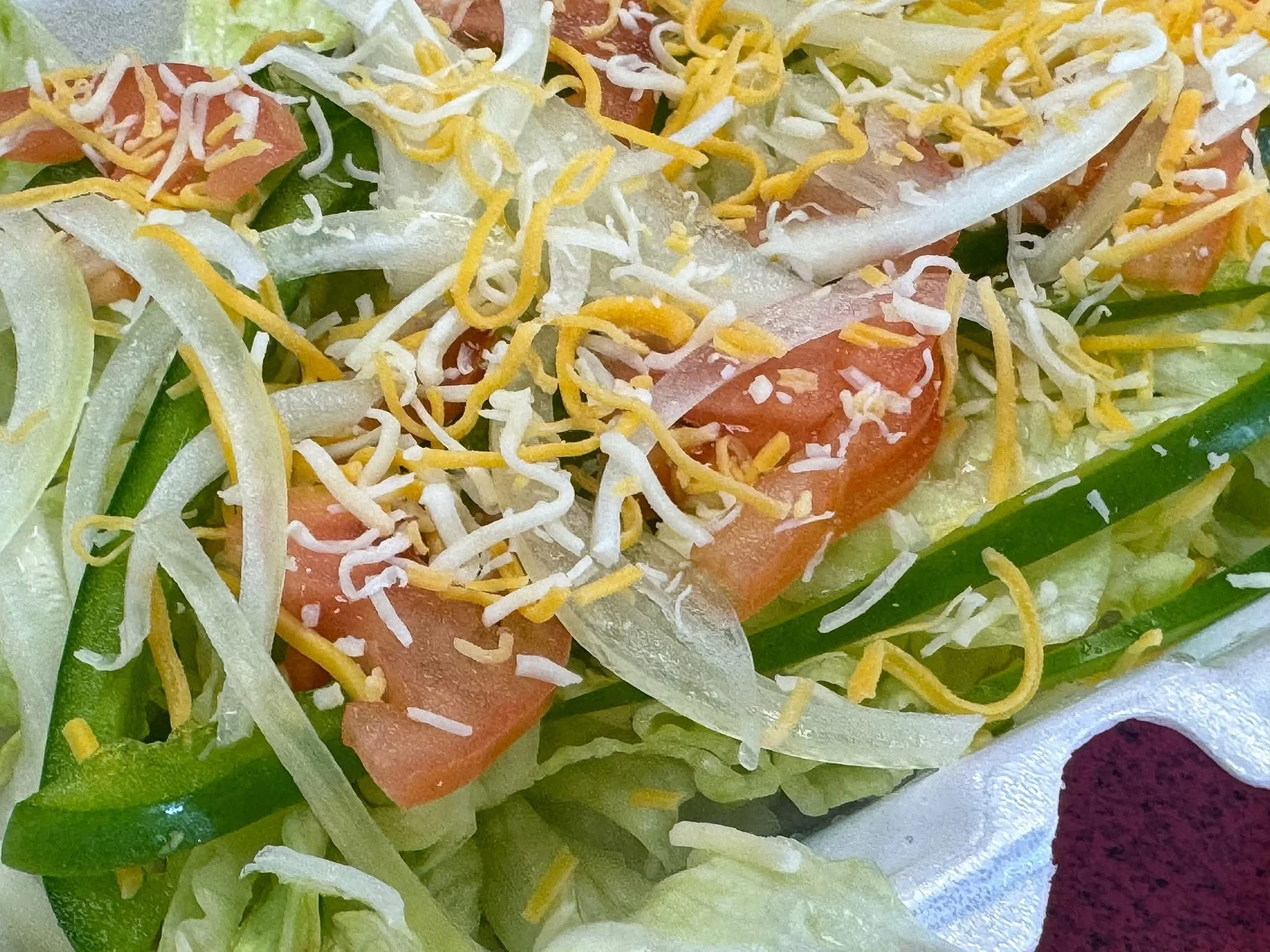 Fresh garden salad with lettuce, tomatoes, and cheese