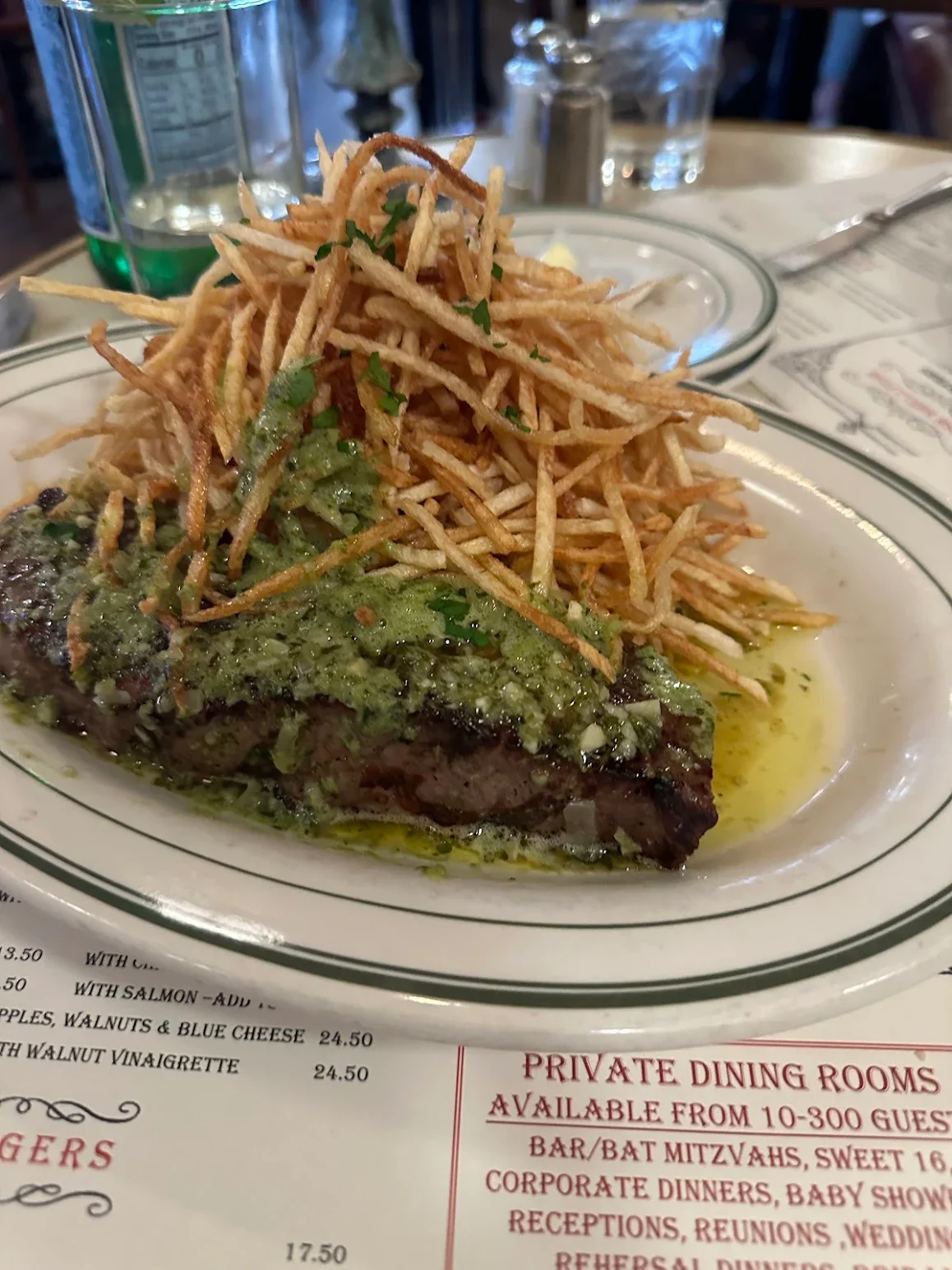 Grilled steak with chimichurri and crispy fries, a classic Argentine dish