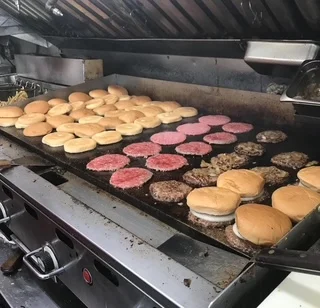Grilling classic American cheeseburgers with toasted buns