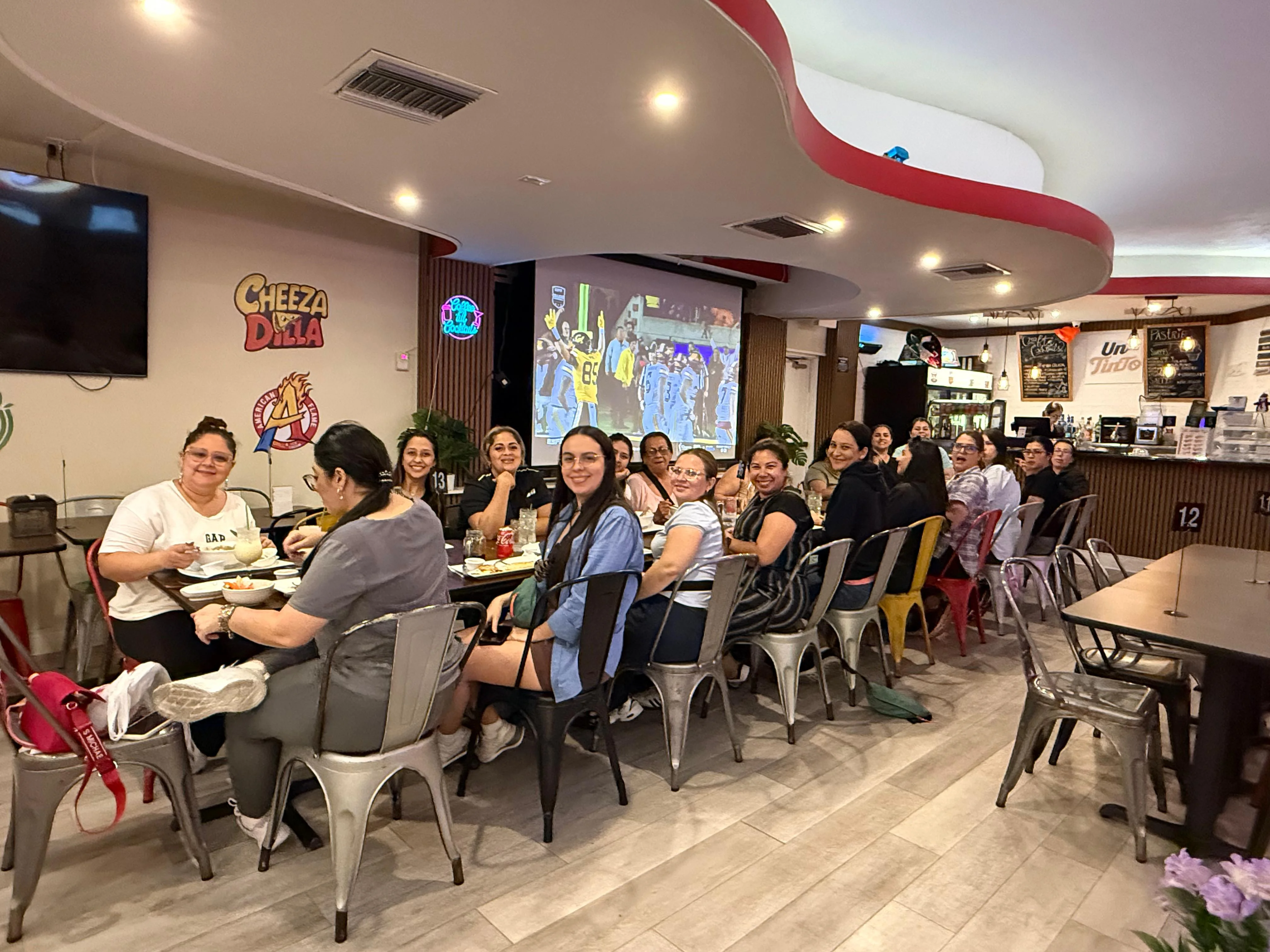 Group of friends enjoying a meal in a vibrant restaurant setting