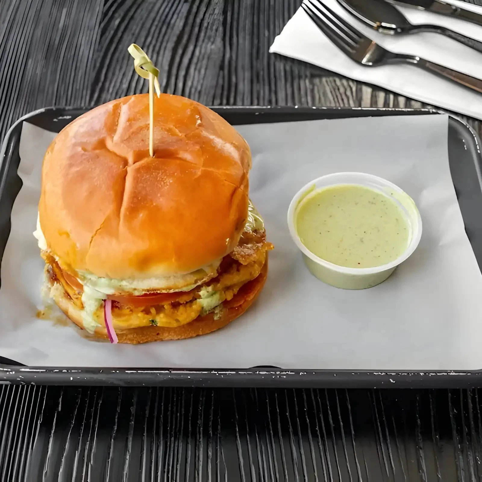 Crispy chicken sandwich with green sauce