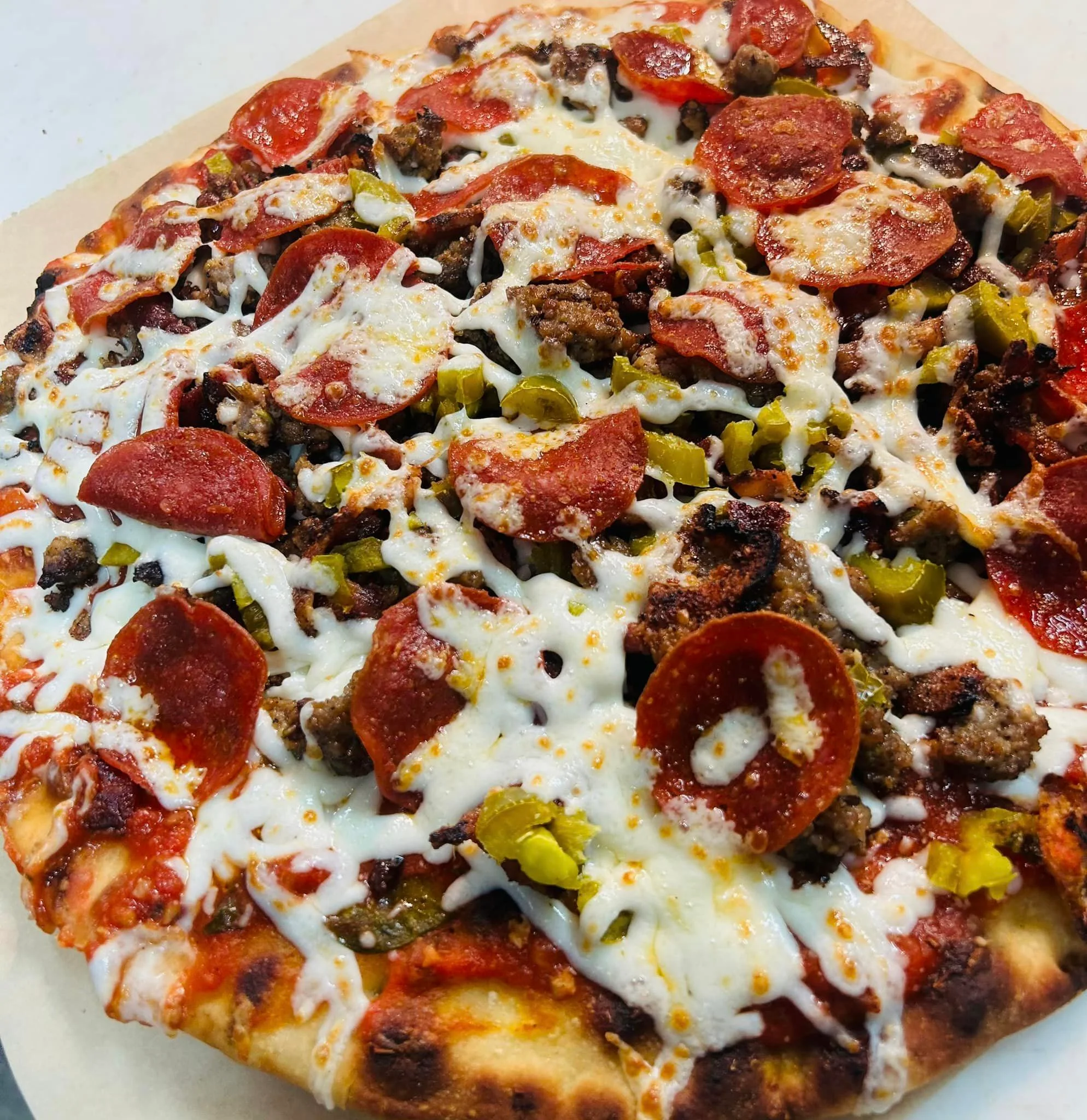 Loaded meat lover's pizza with pepperoni and sausage