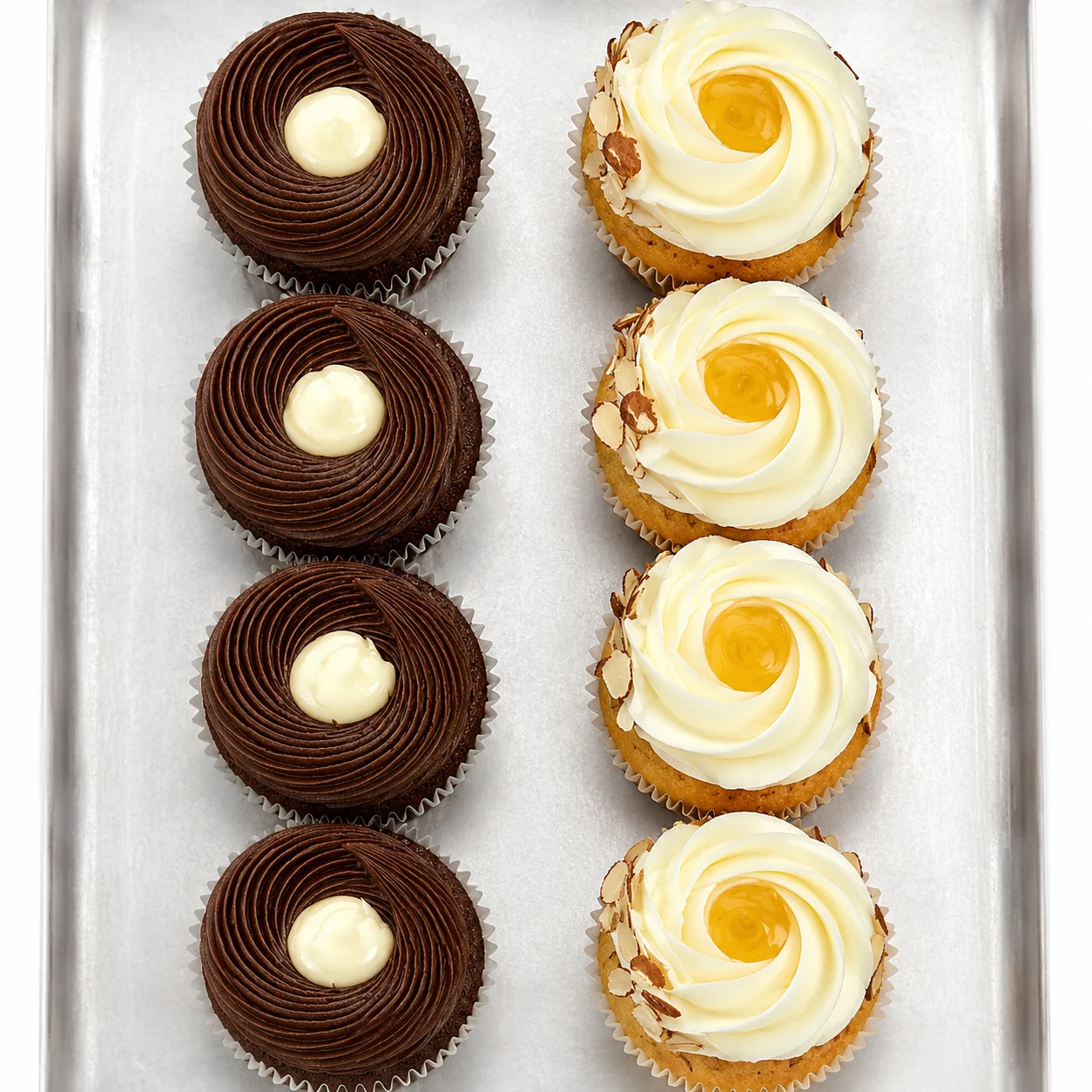 Decadent chocolate and vanilla cupcakes on a silver tray