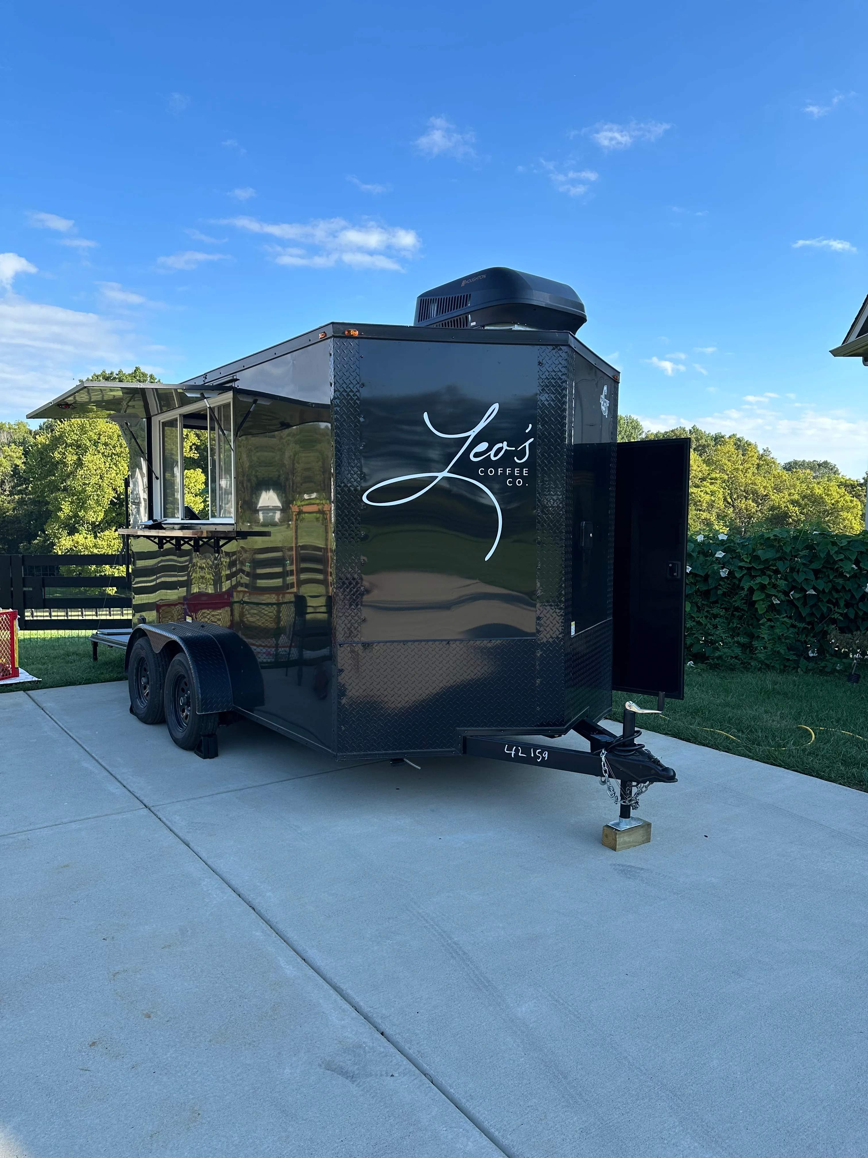 Mobile coffee trailer with sleek design and branding
