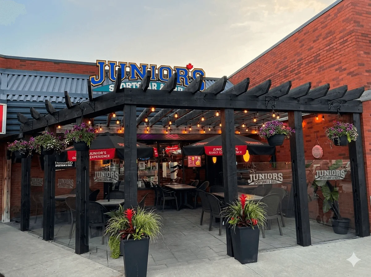 Outdoor dining area of Juniors Sports Bar with cozy lighting