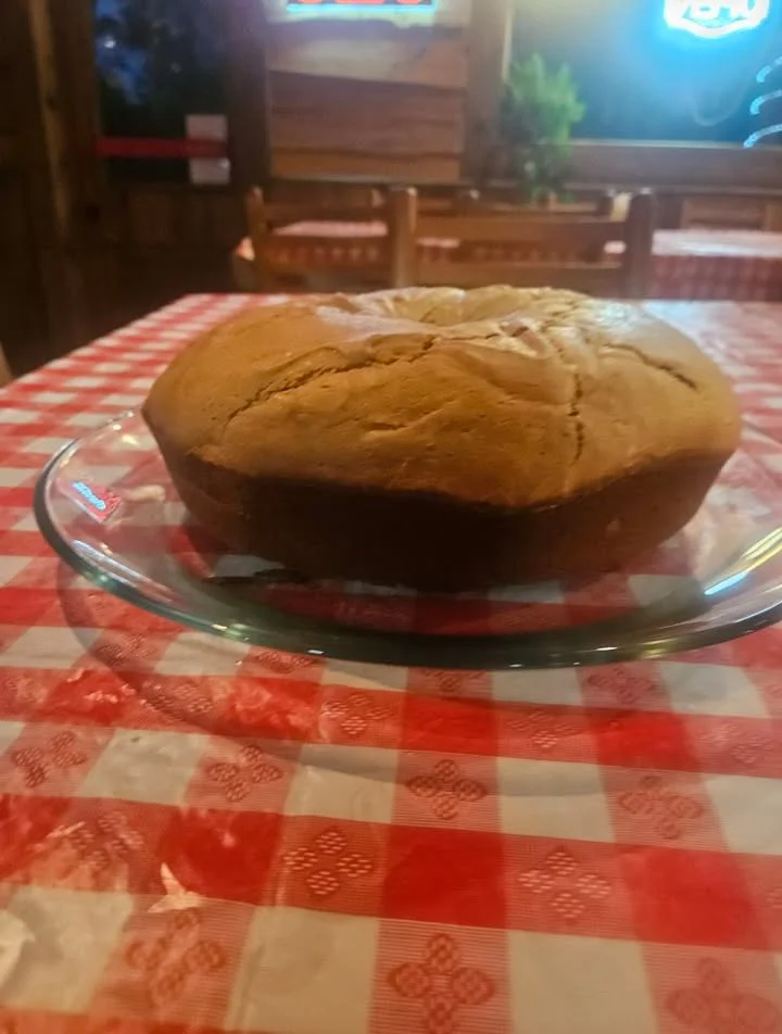 Freshly baked cornbread on a glass plate