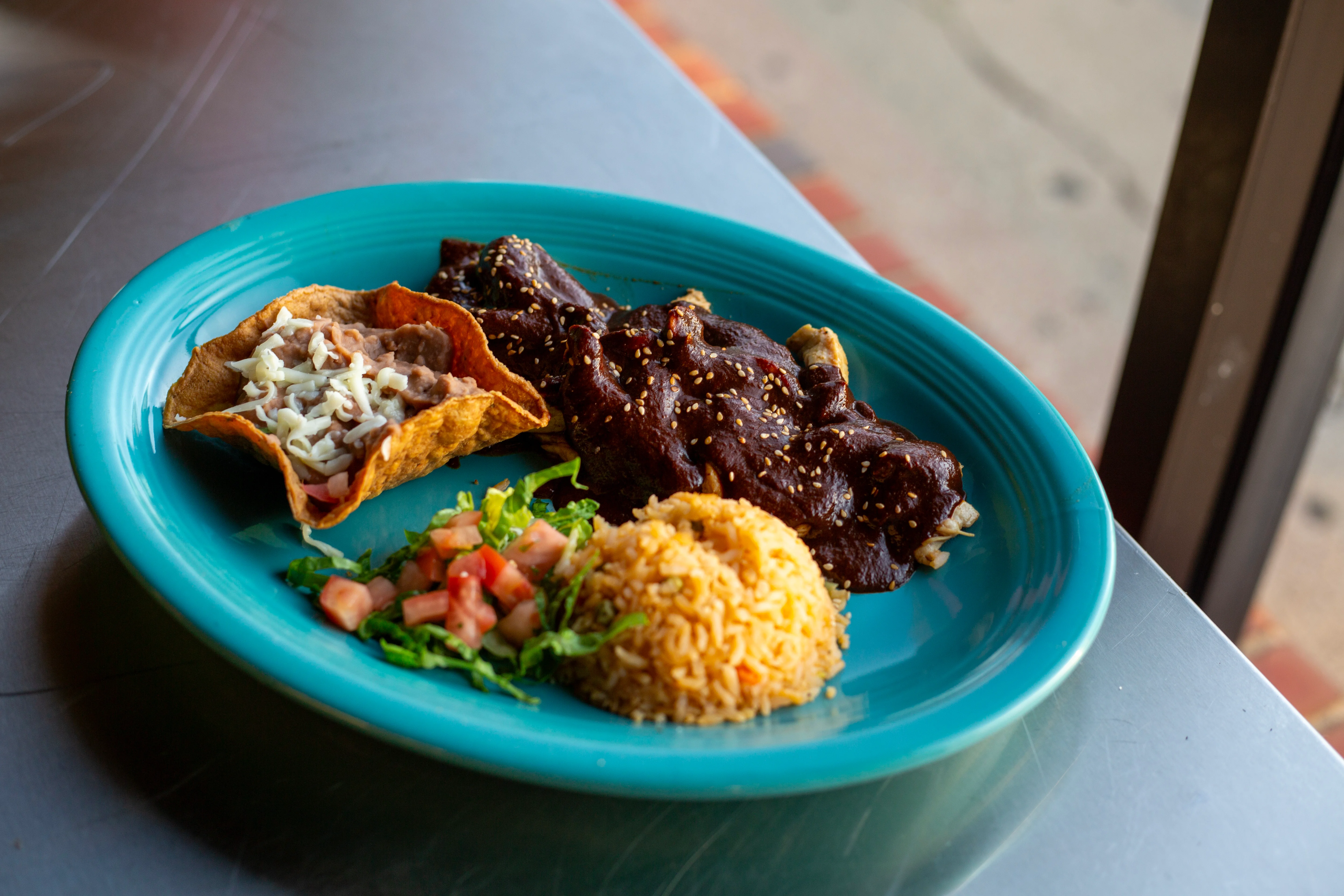 Authentic Mexican mole chicken with rice and taco