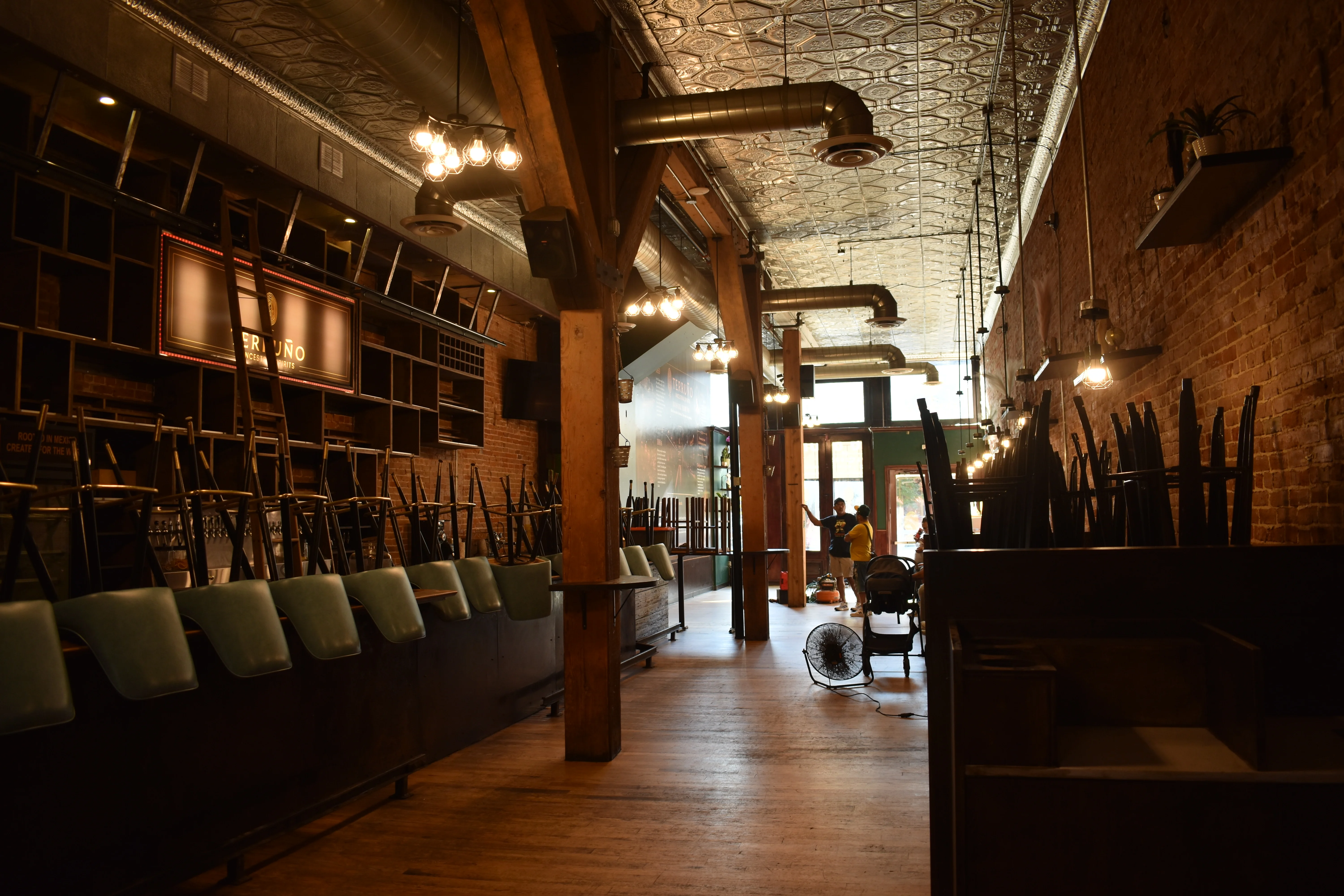 Cozy restaurant interior with wooden beams and warm lighting