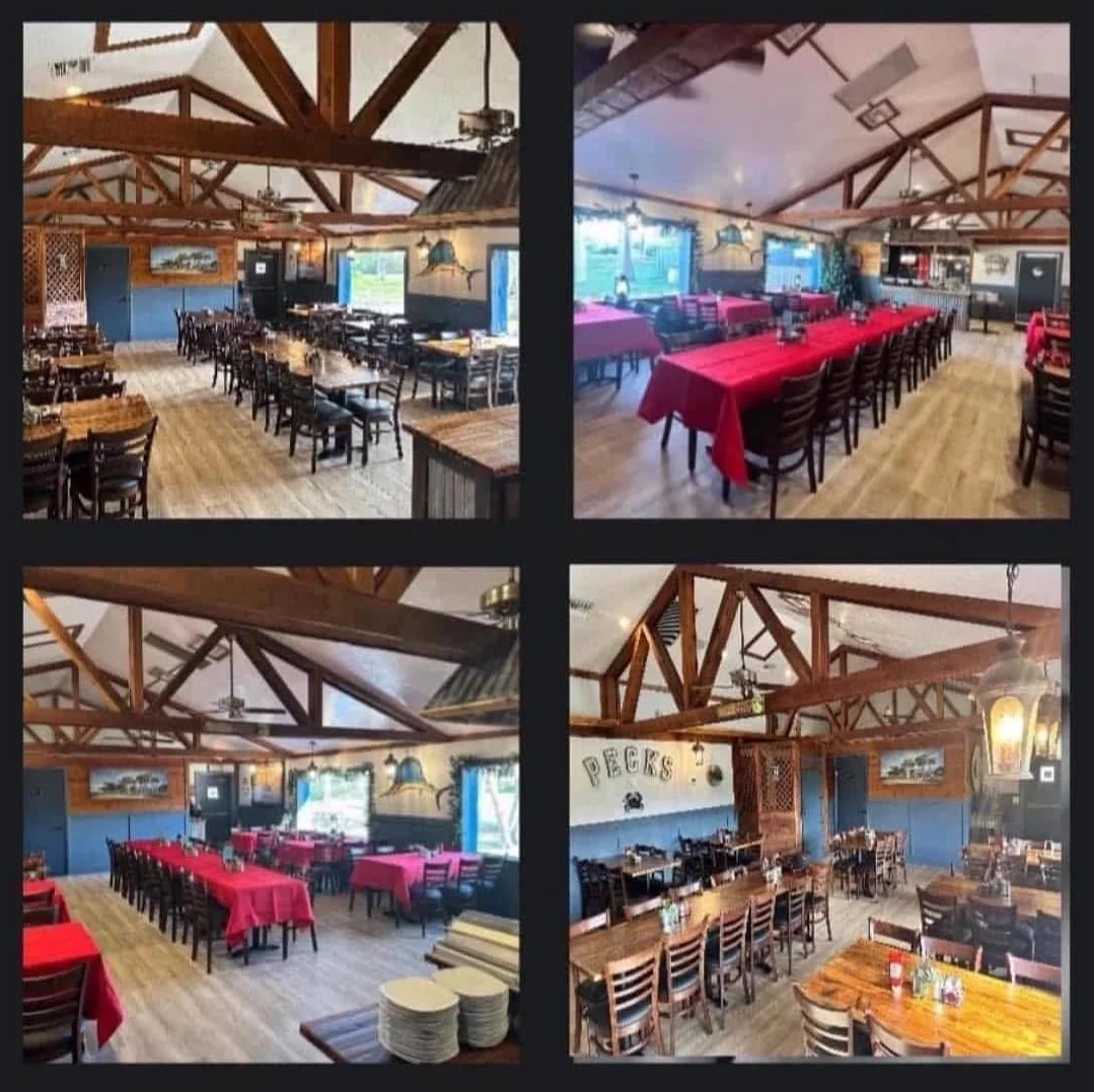 Elegant Tarpon Room dining area with wooden beams and red tablecloths