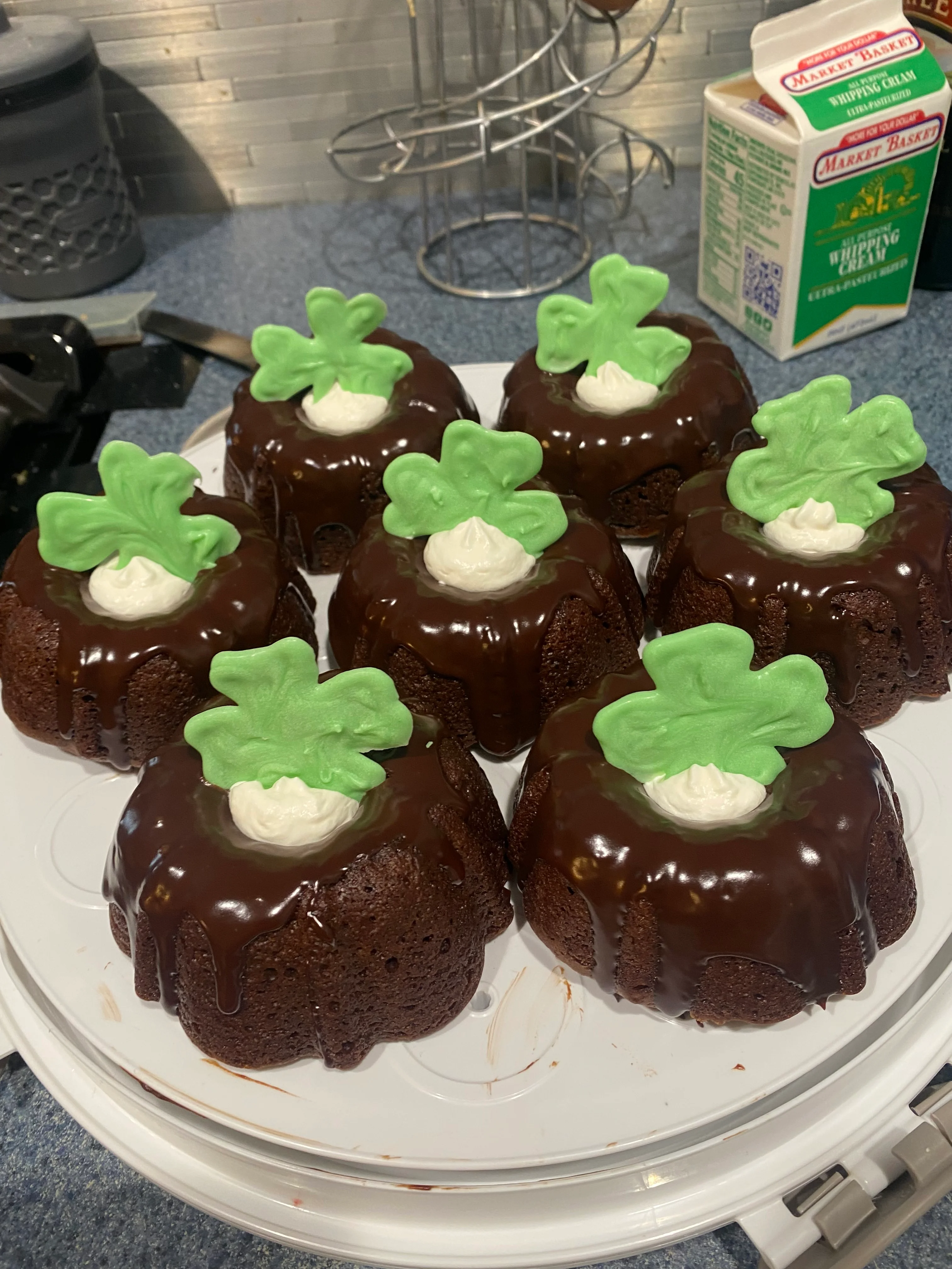 Chocolate mini bundt cakes with green shamrock decorations