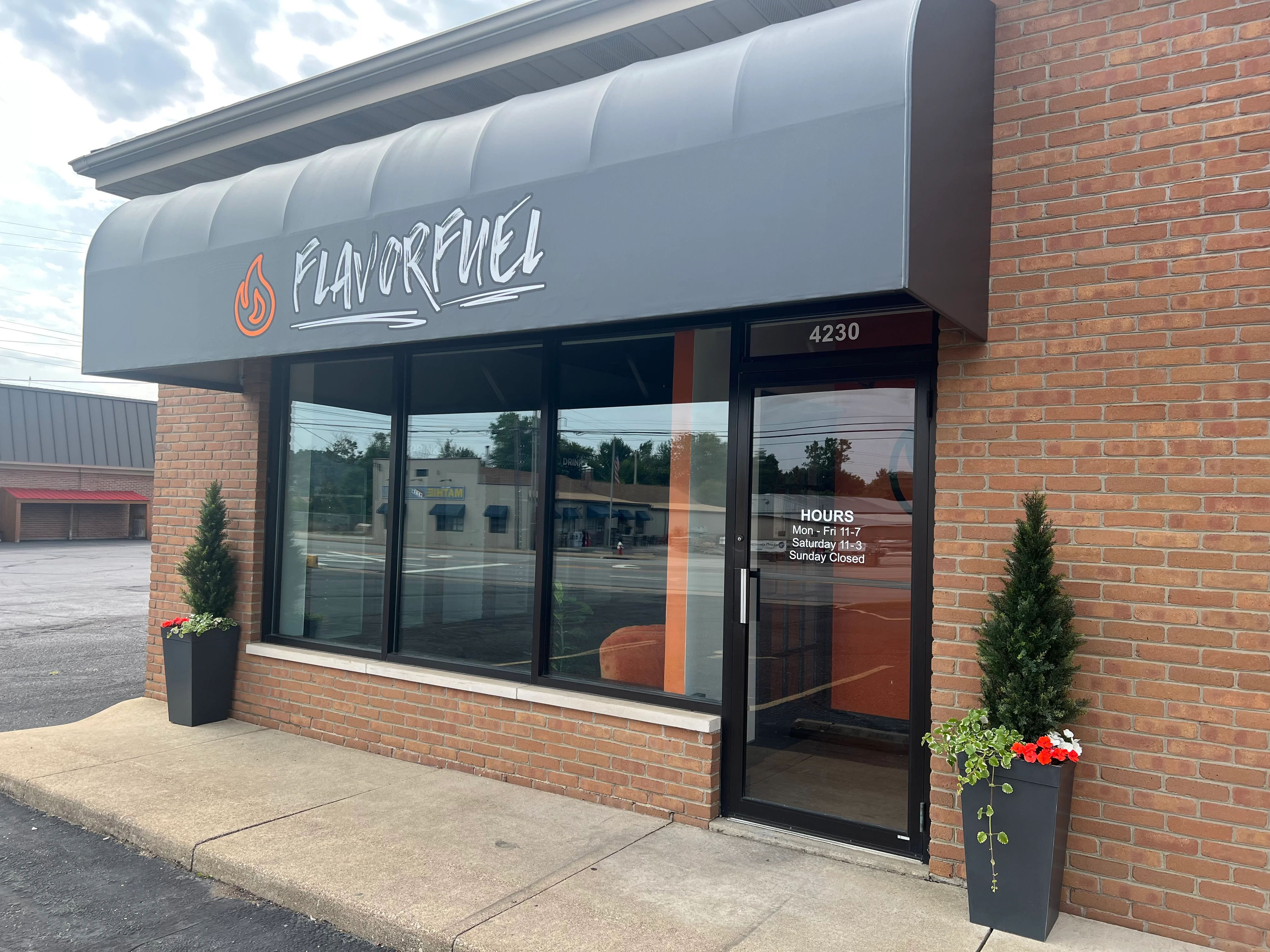 Exterior view of FlavorFuel restaurant with modern signage