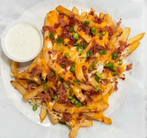 Loaded cheese fries with bacon and green onions