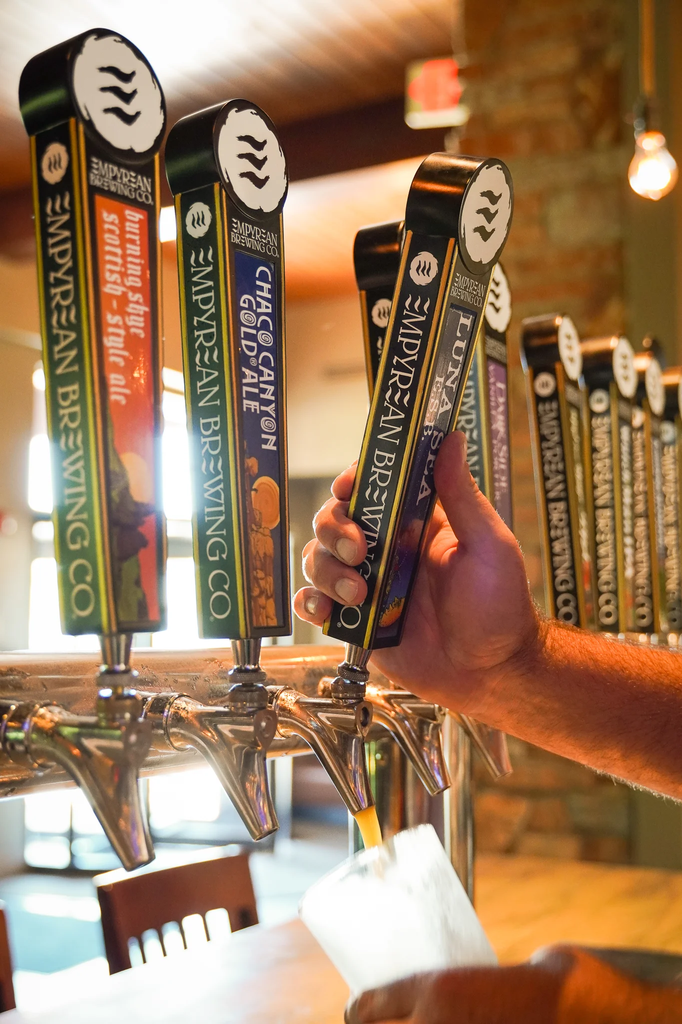 Craft beer taps at a brewery bar
