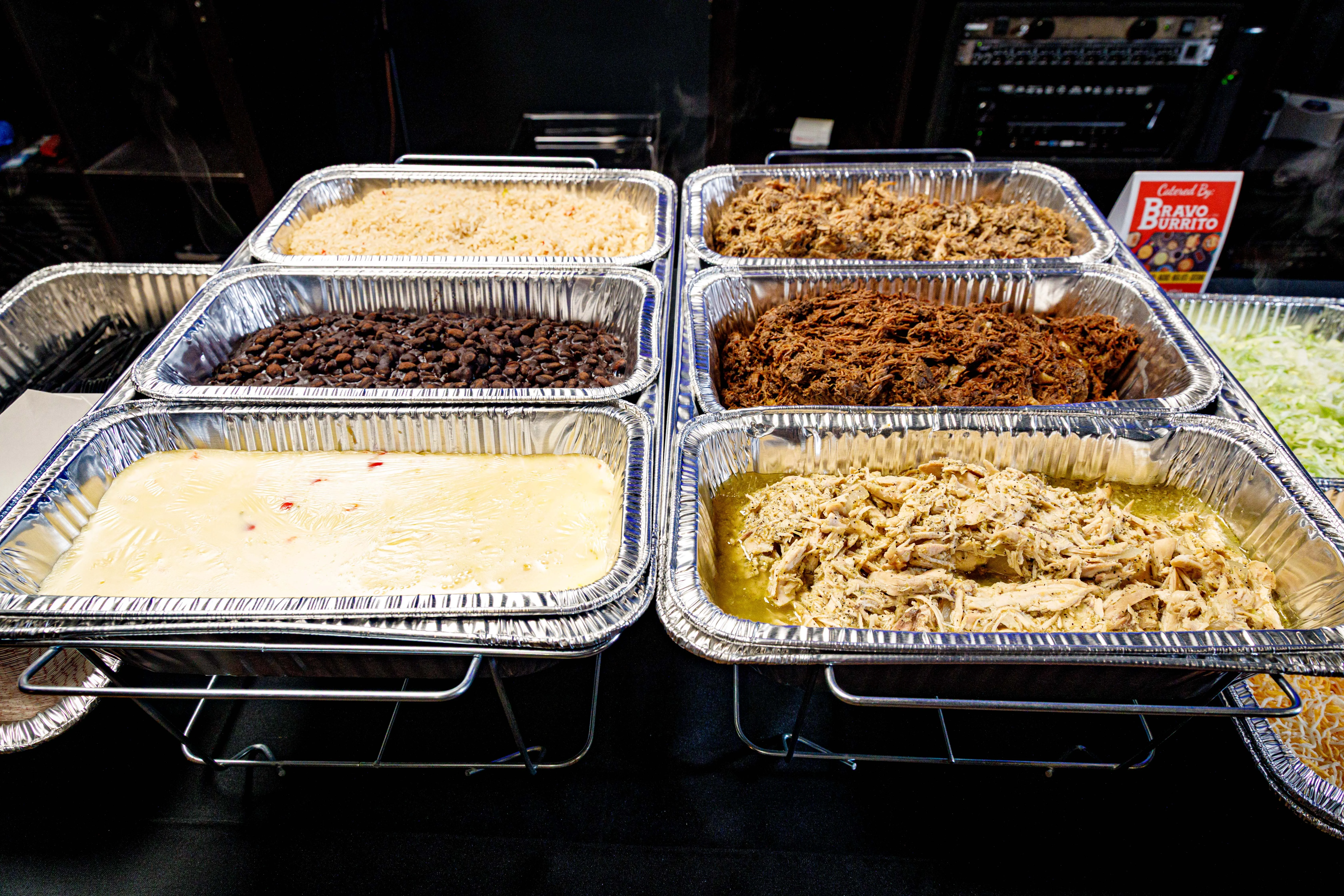 A beautifully arranged holiday catering spread with festive dishes.