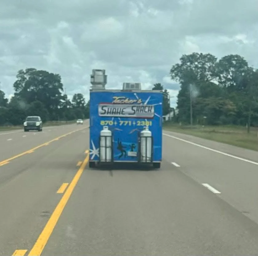 Mobile shave shack trailer traveling on a highway