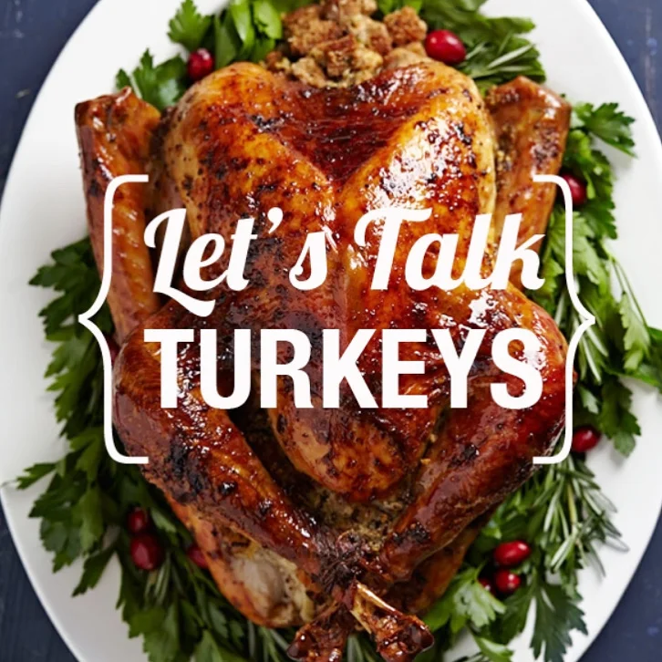 Roasted Thanksgiving turkey garnished with parsley, cranberries, and rosemary