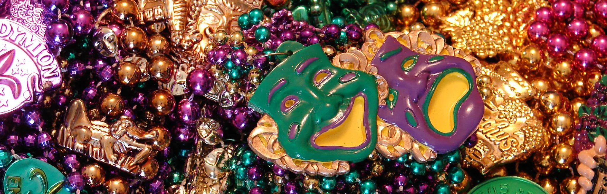 Colorful Mardi Gras beads and masks in vibrant hues