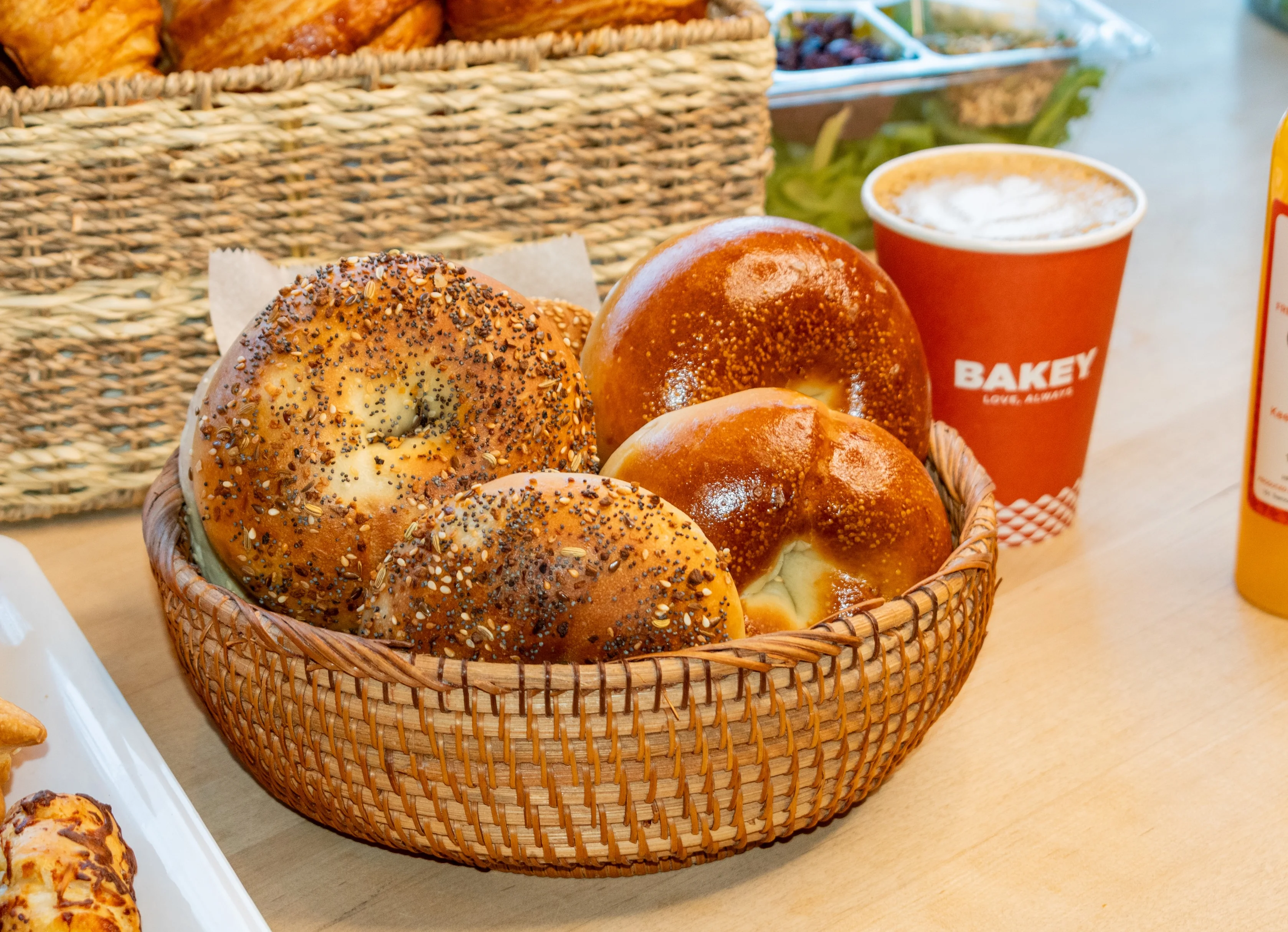 Freshly baked bagels in a woven basket