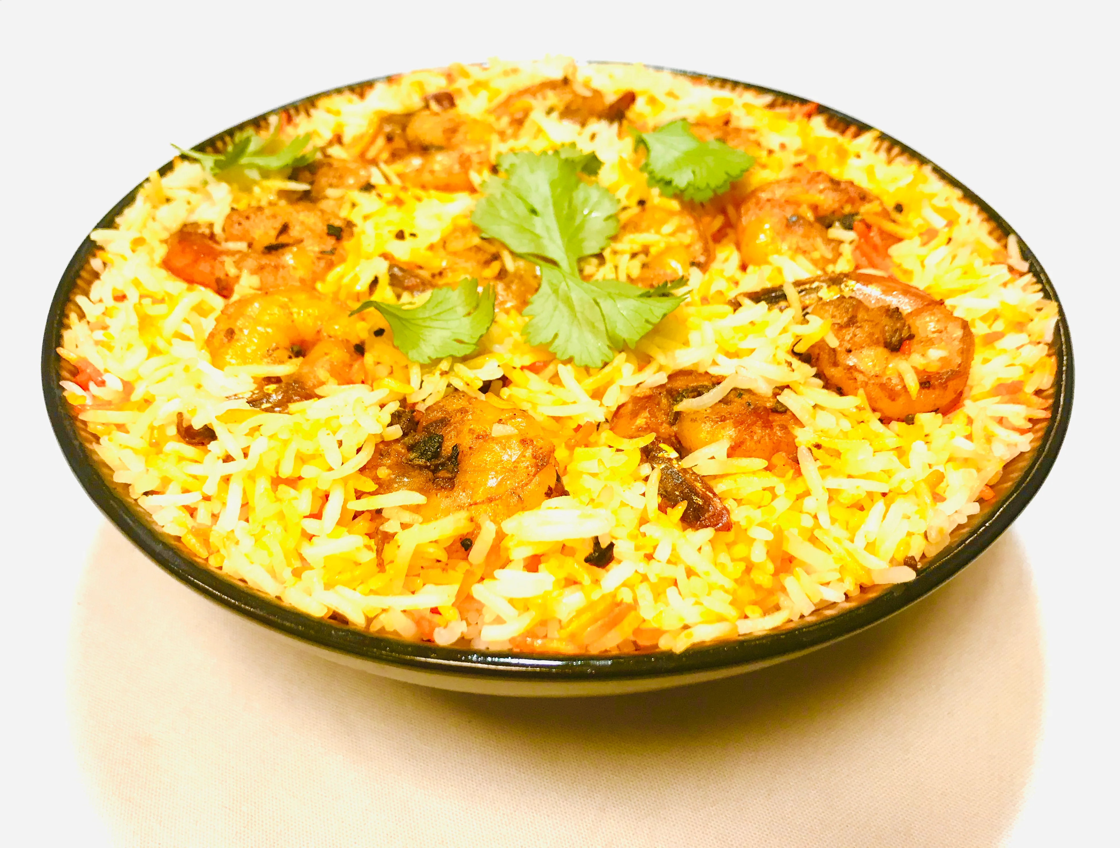 Delicious shrimp biryani served in a traditional bowl