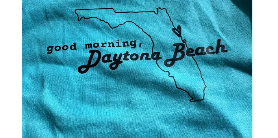 Graphic design featuring Florida outline and greeting for Daytona Beach