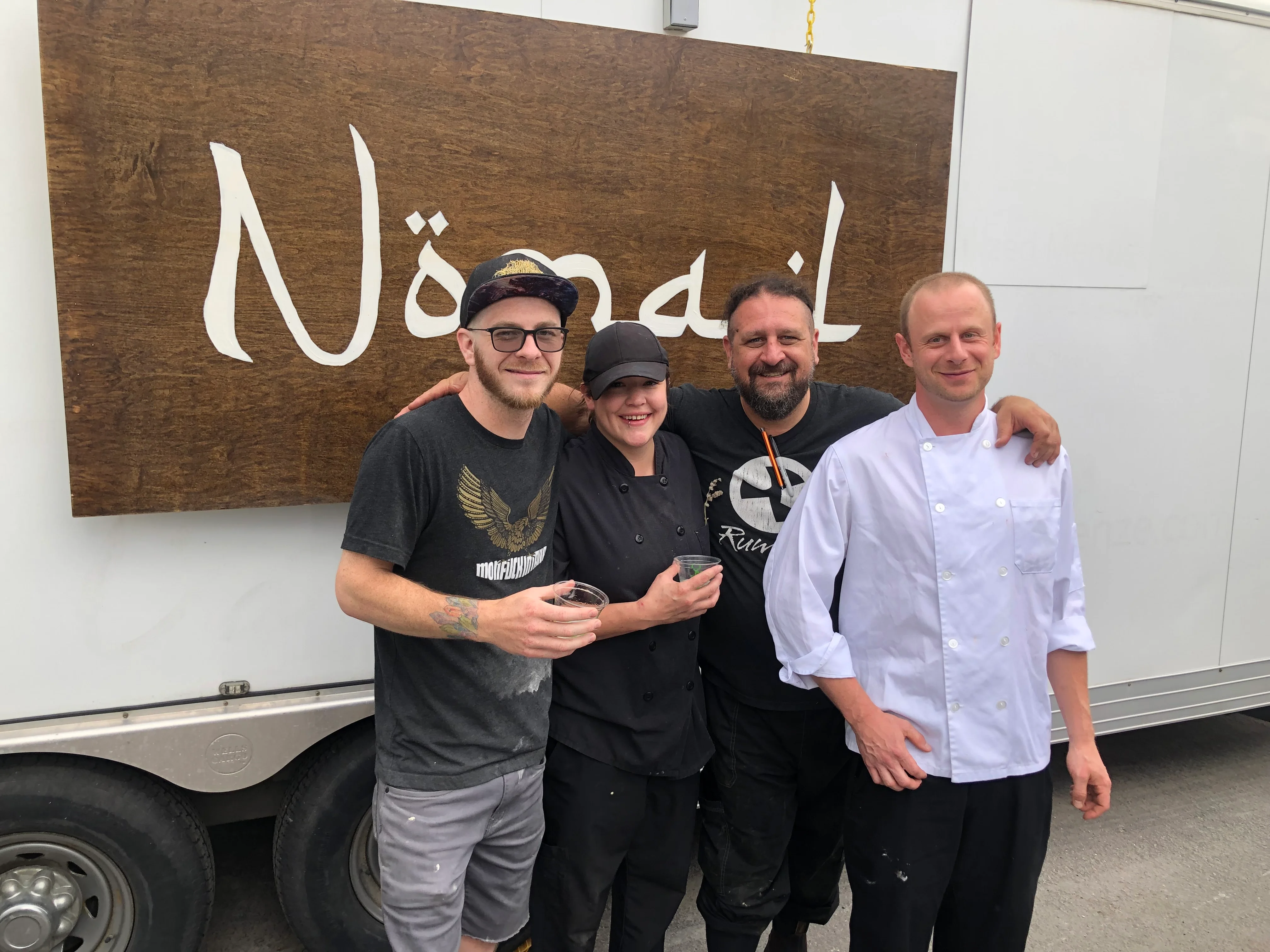 Culinary team posing in front of Nömail food truck